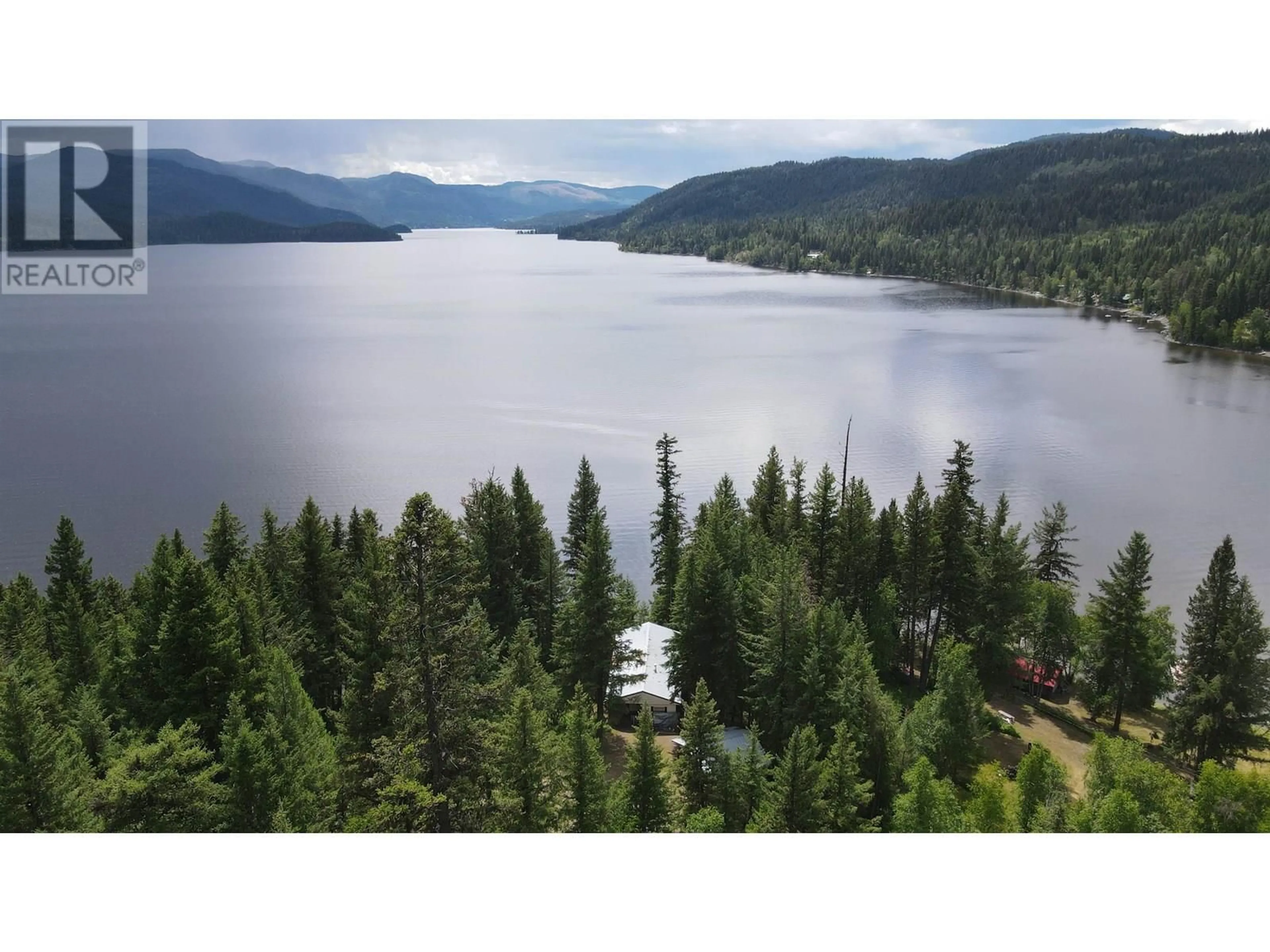 A pic from outside/outdoor area/front of a property/back of a property/a pic from drone, water/lake/river/ocean view for 7582 RESORT ROAD, Canim Lake British Columbia V0K1L0