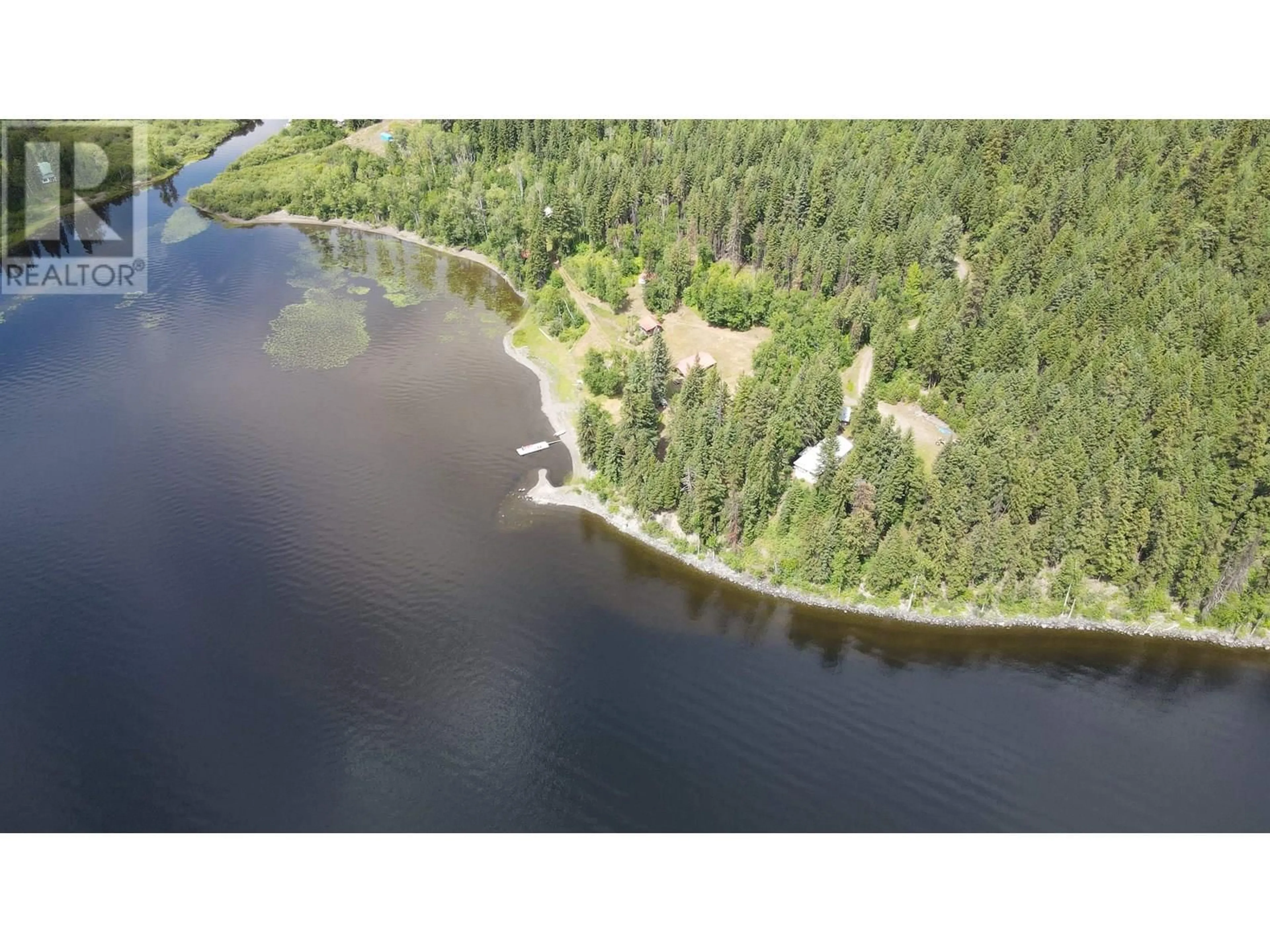 A pic from outside/outdoor area/front of a property/back of a property/a pic from drone, water/lake/river/ocean view for 7582 RESORT ROAD, Canim Lake British Columbia V0K1L0