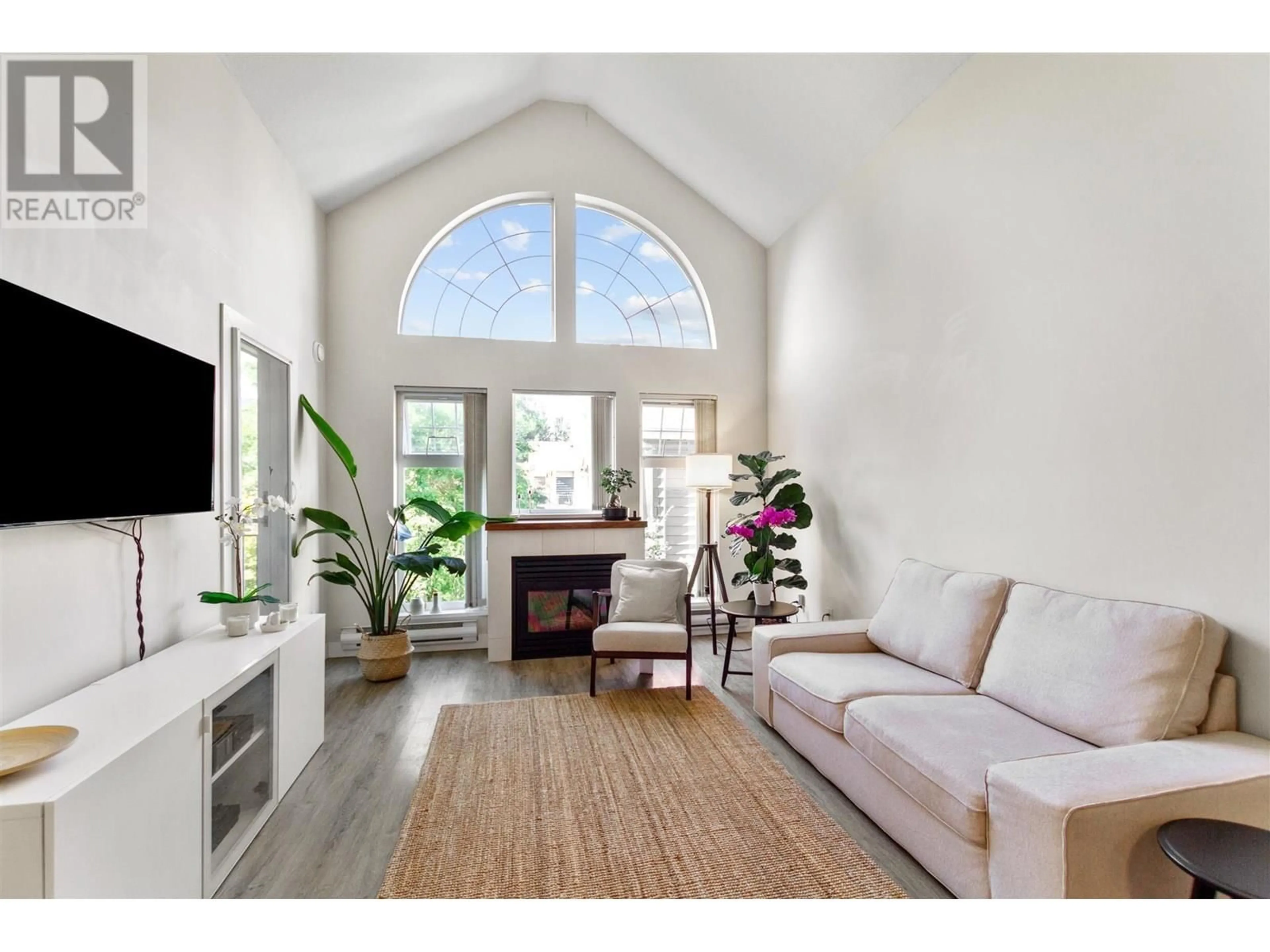 Living room with furniture, wood/laminate floor for 406 - 3085 PRIMROSE LANE, Coquitlam British Columbia V3B7S3