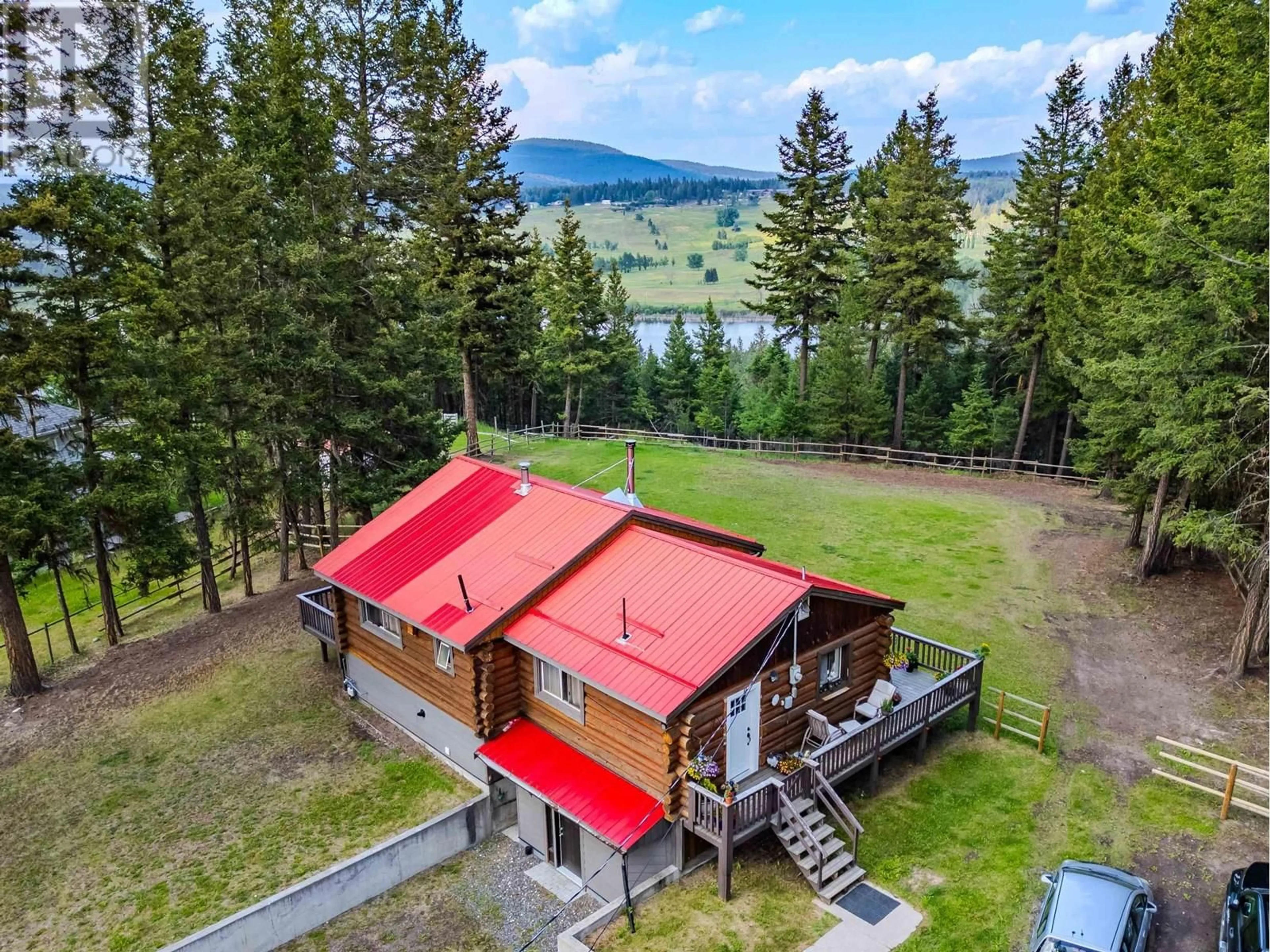A pic from outside/outdoor area/front of a property/back of a property/a pic from drone, mountain view for 4943 KYLLO ROAD, 108 Mile Ranch British Columbia V0K2Z0
