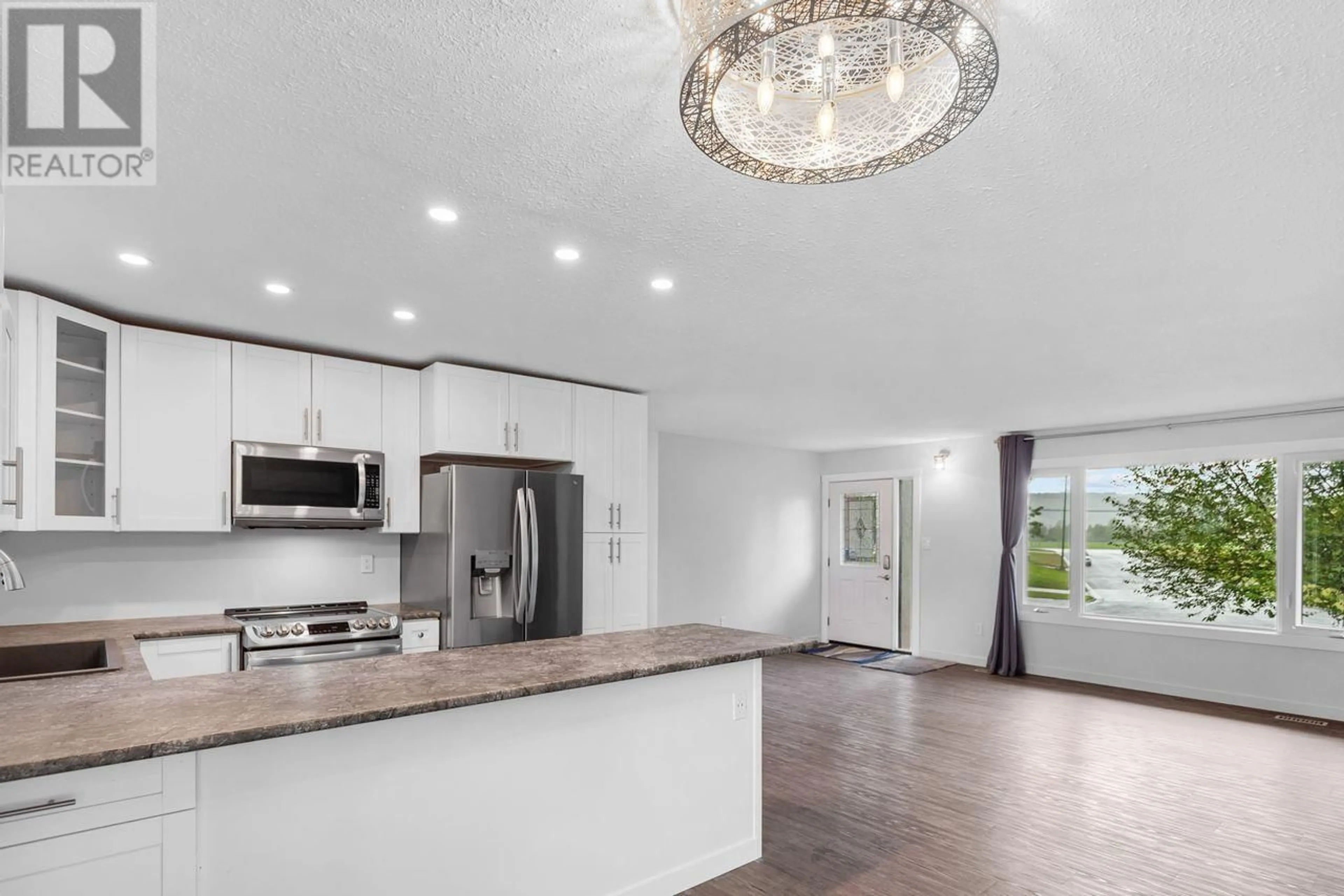 Open concept kitchen, unknown for 1758 REBMAN CRESCENT, Prince George British Columbia V2L2T9