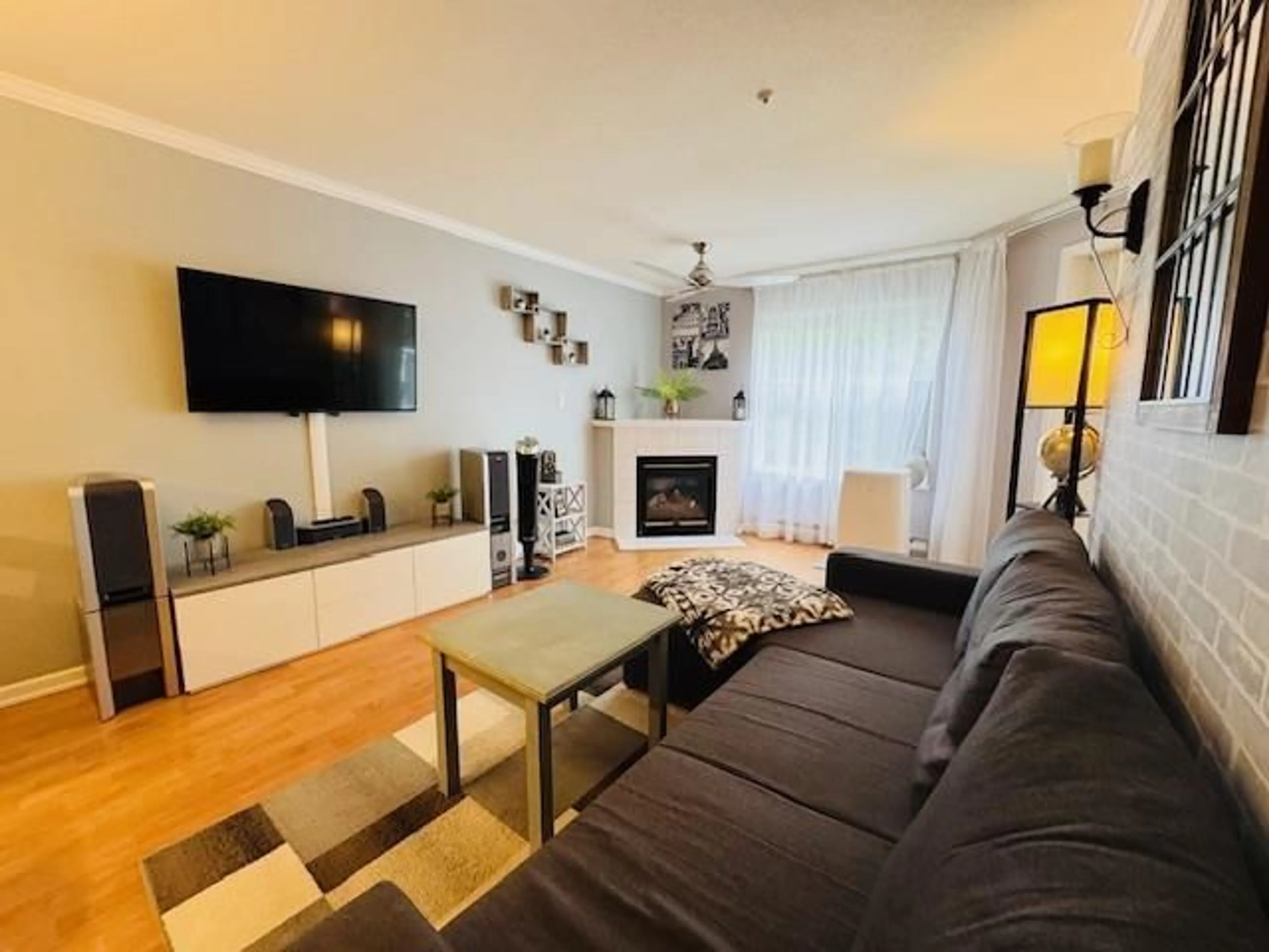 Living room with furniture, wood/laminate floor for 208 - 12739 72, Surrey British Columbia V3W2M7