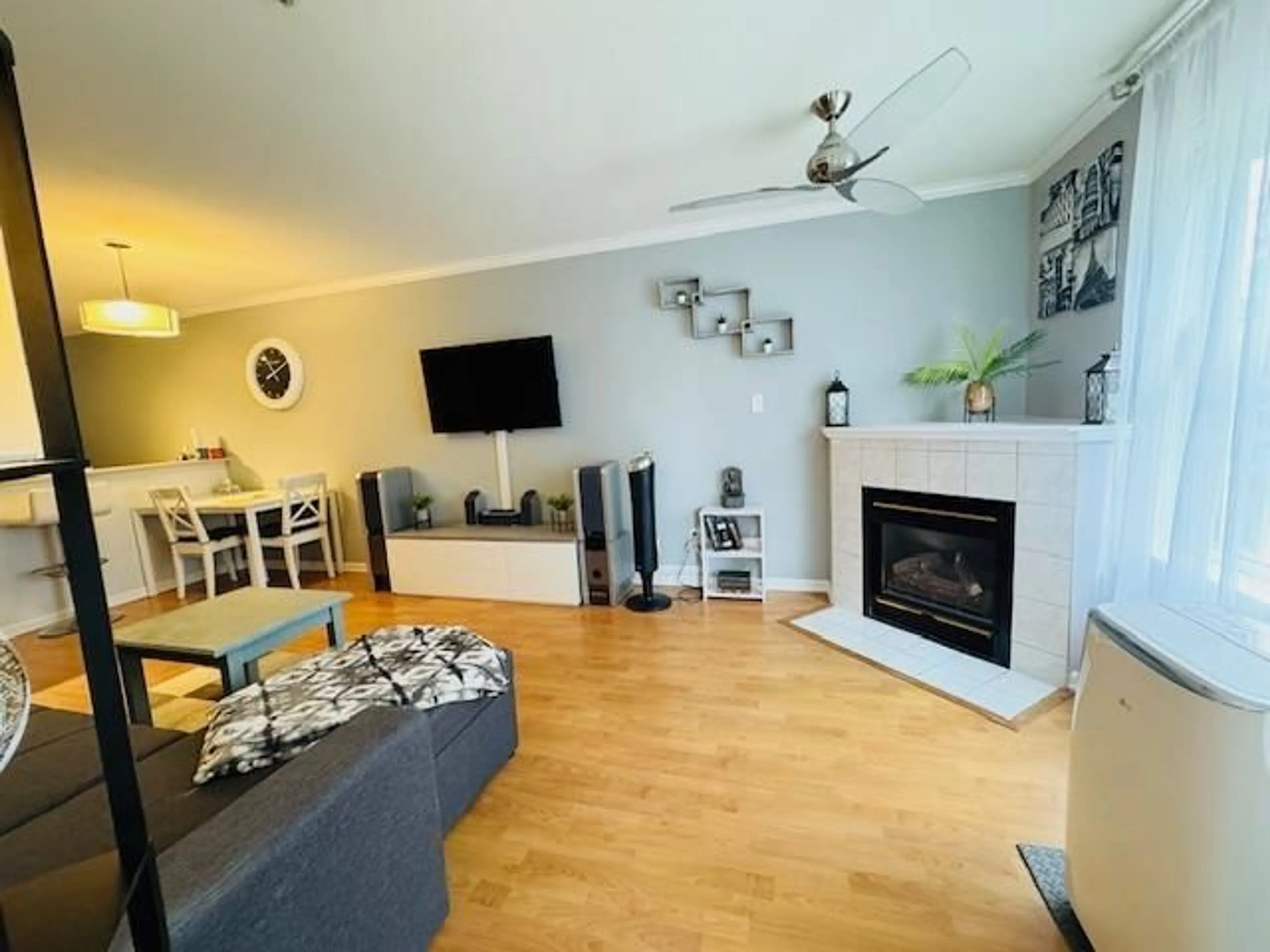 Living room with furniture, wood/laminate floor for 208 - 12739 72, Surrey British Columbia V3W2M7