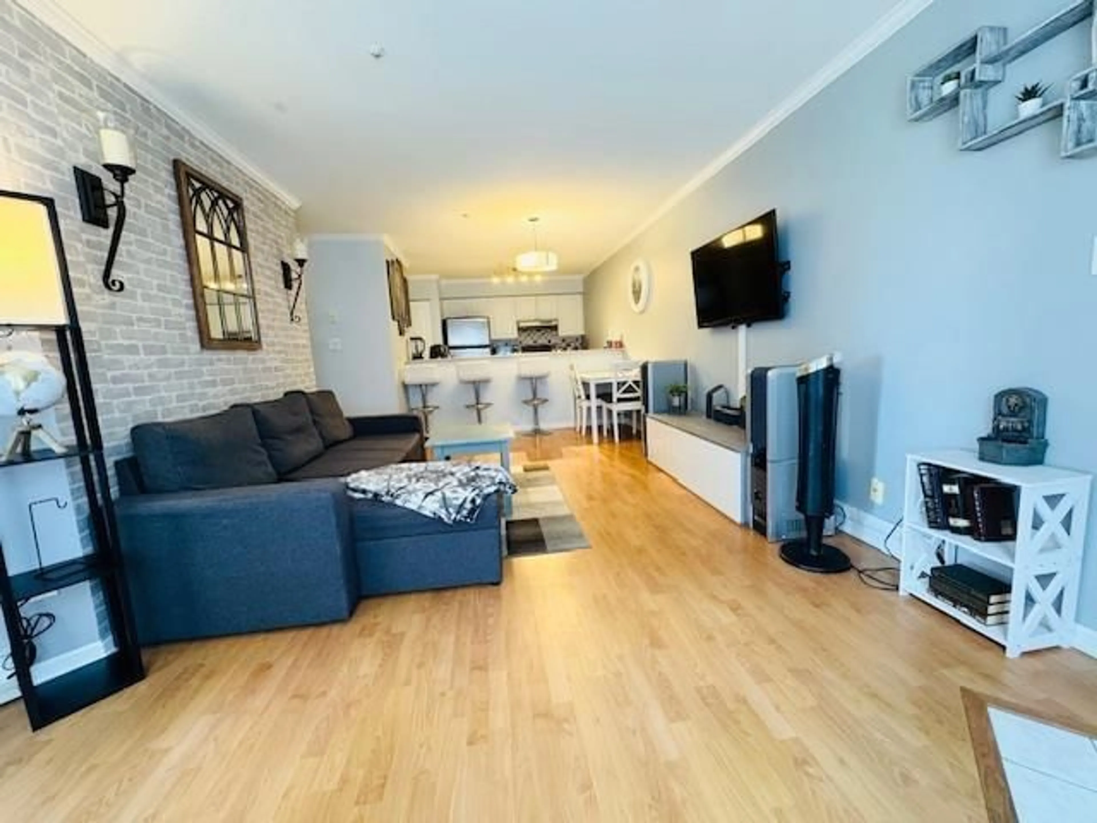 Living room with furniture, wood/laminate floor for 208 - 12739 72, Surrey British Columbia V3W2M7