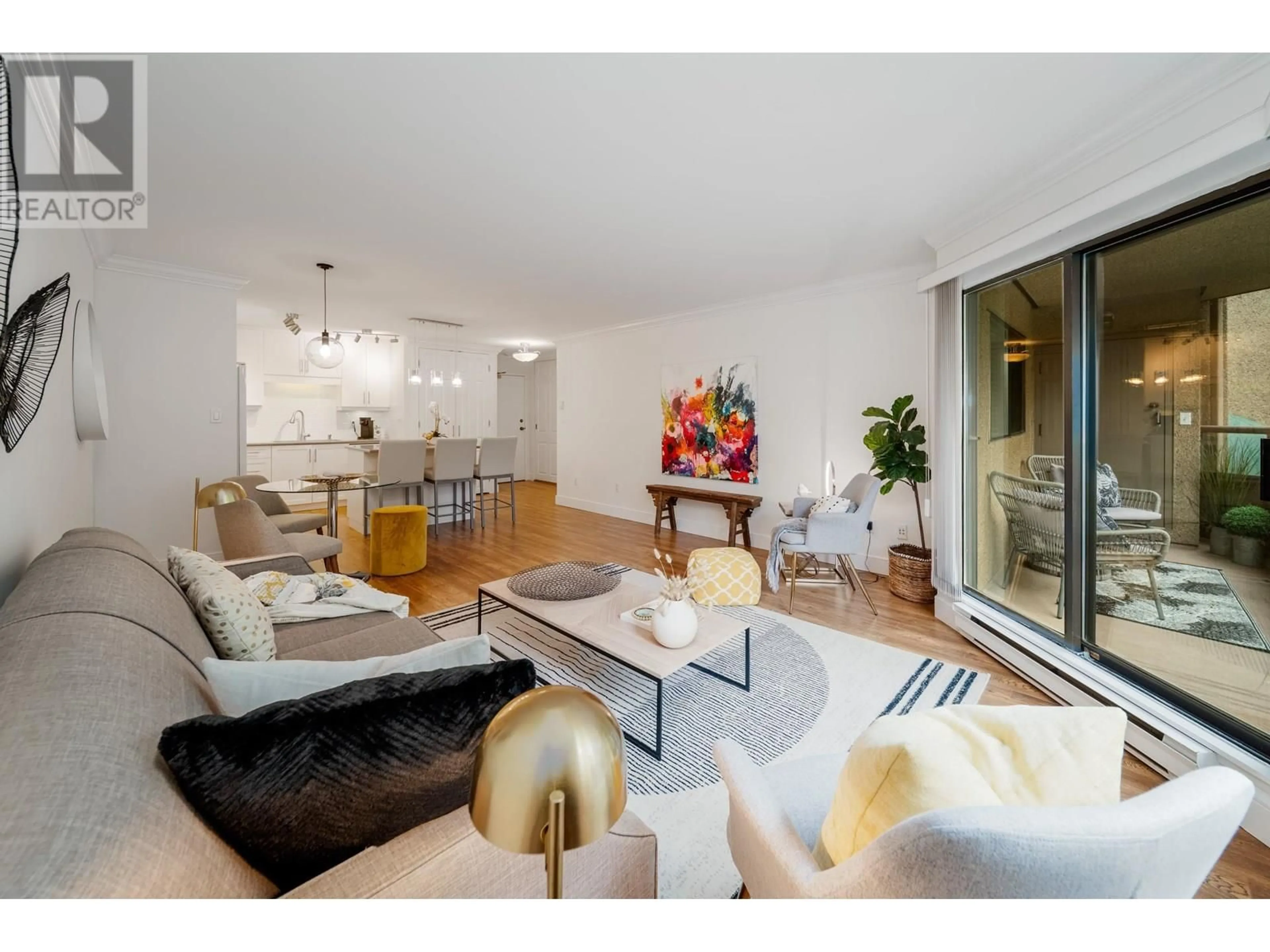 Living room with furniture, wood/laminate floor for 106 - 1750 AUGUSTA AVENUE, Burnaby British Columbia V5A2V6