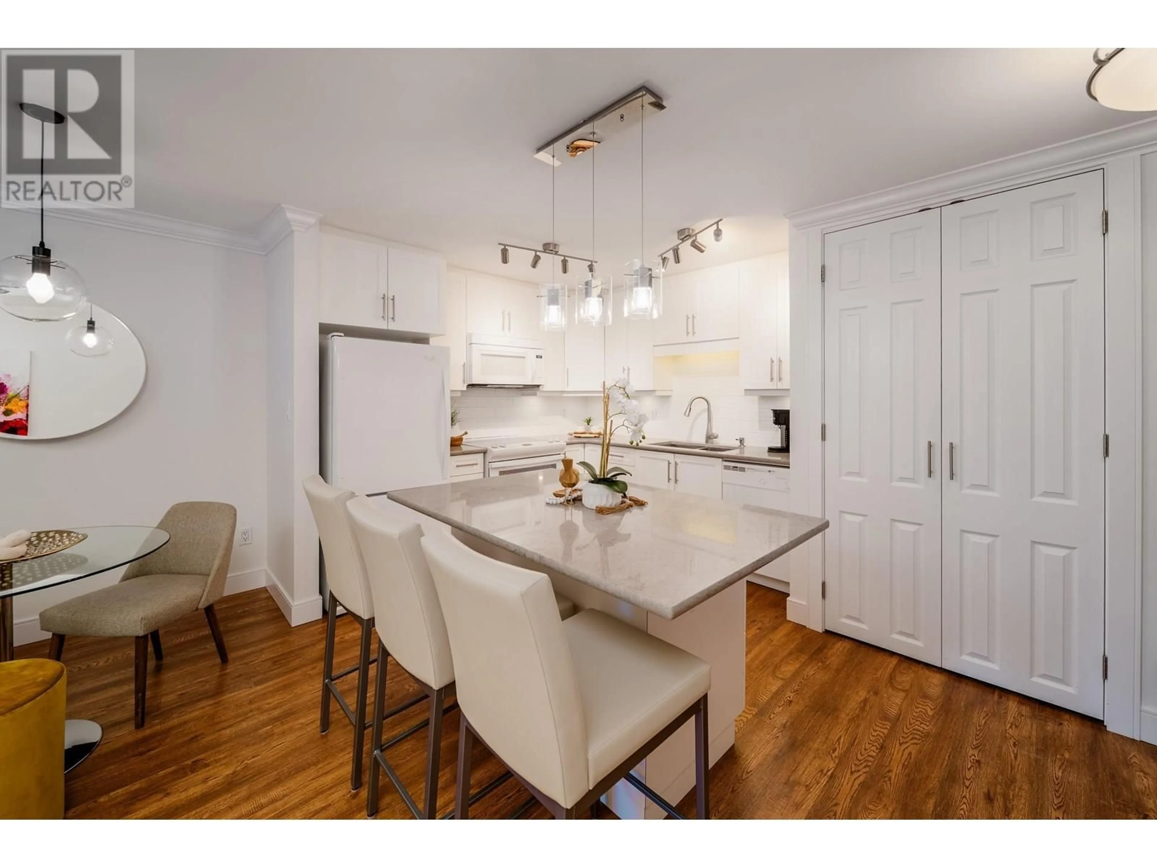 Open concept kitchen, wood/laminate floor for 106 - 1750 AUGUSTA AVENUE, Burnaby British Columbia V5A2V6