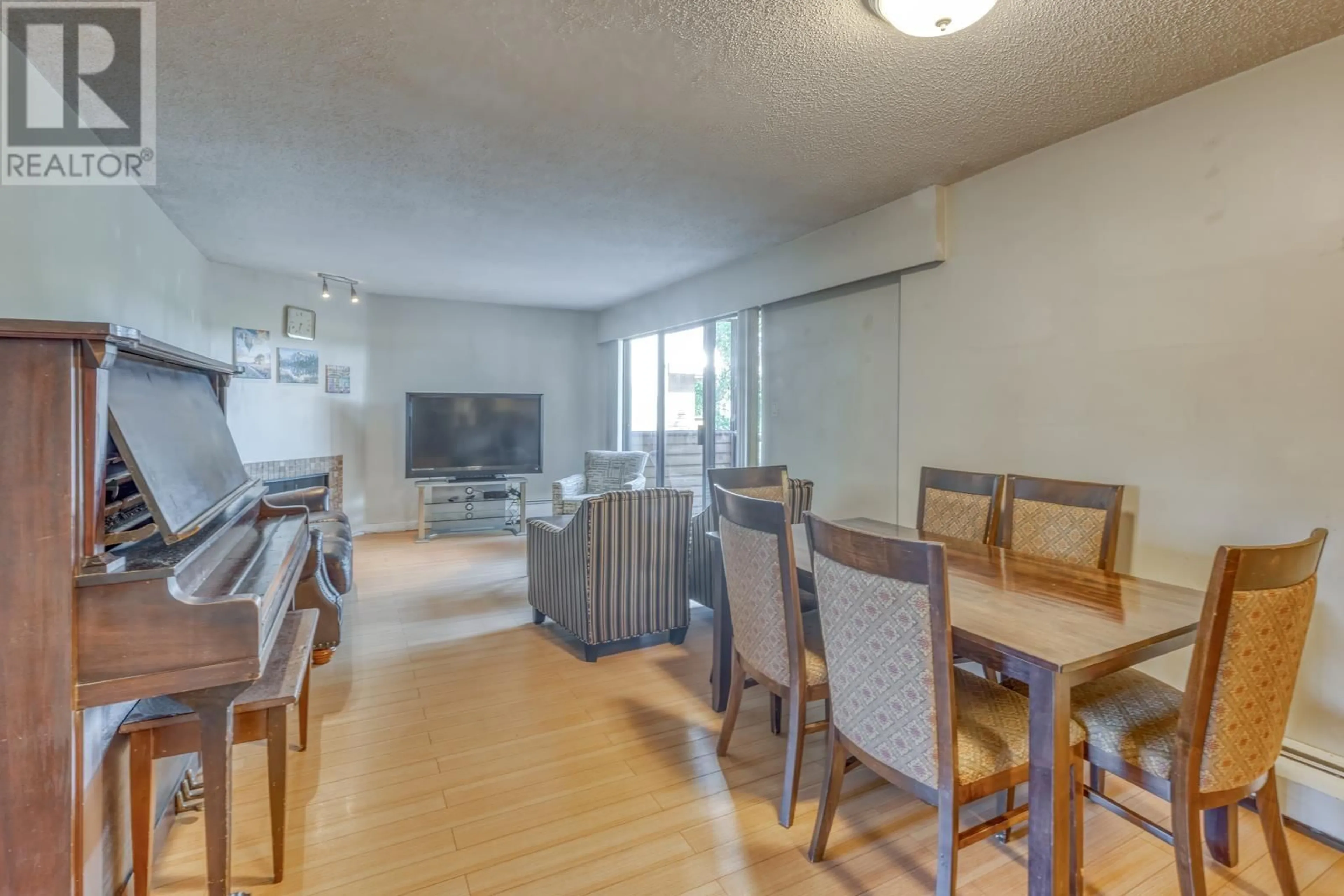Dining room, wood/laminate floor for 212 - 2277 30TH AVENUE, Vancouver British Columbia V5N5N1