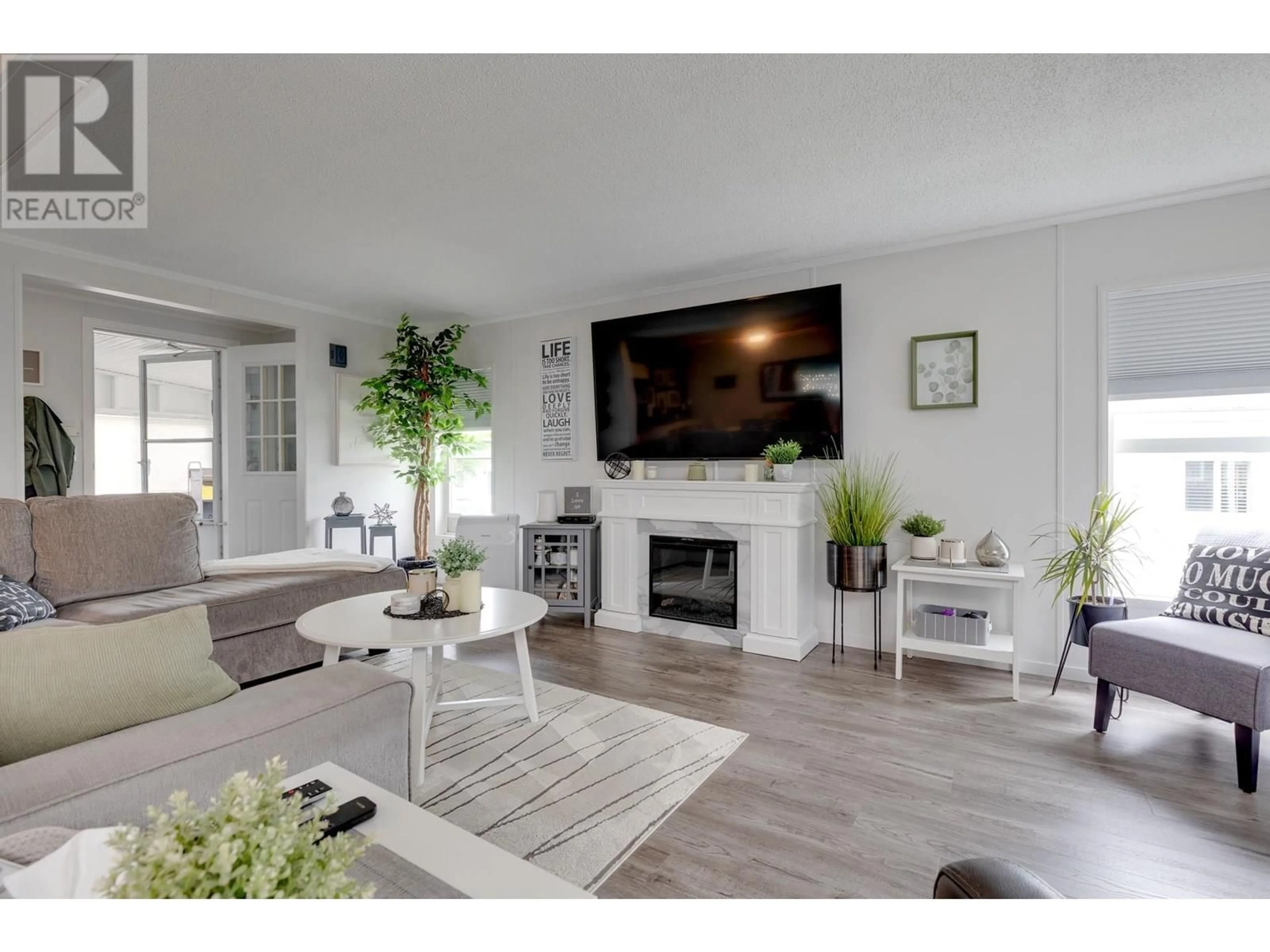 Living room with furniture, wood/laminate floor for 67 - 1000 INVERNESS ROAD, Prince George British Columbia V2K4V1