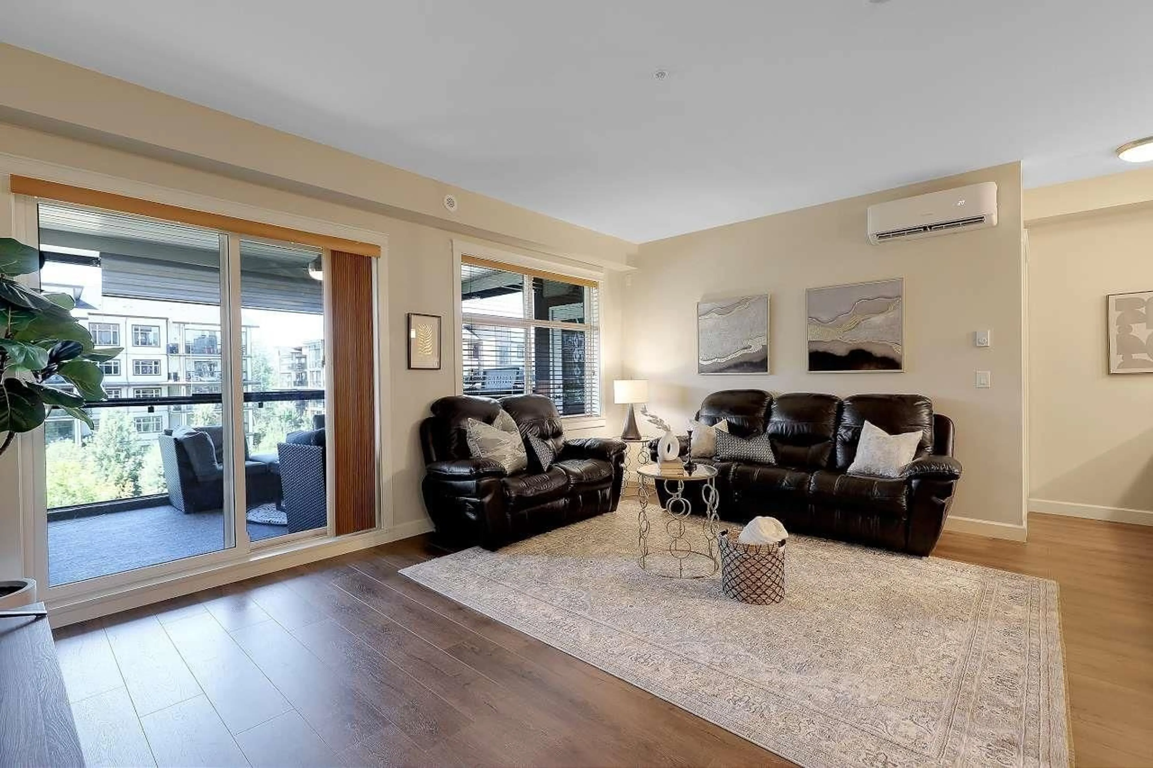 Living room with furniture, wood/laminate floor for 308 - 8561 203A, Langley British Columbia V2Y3L7