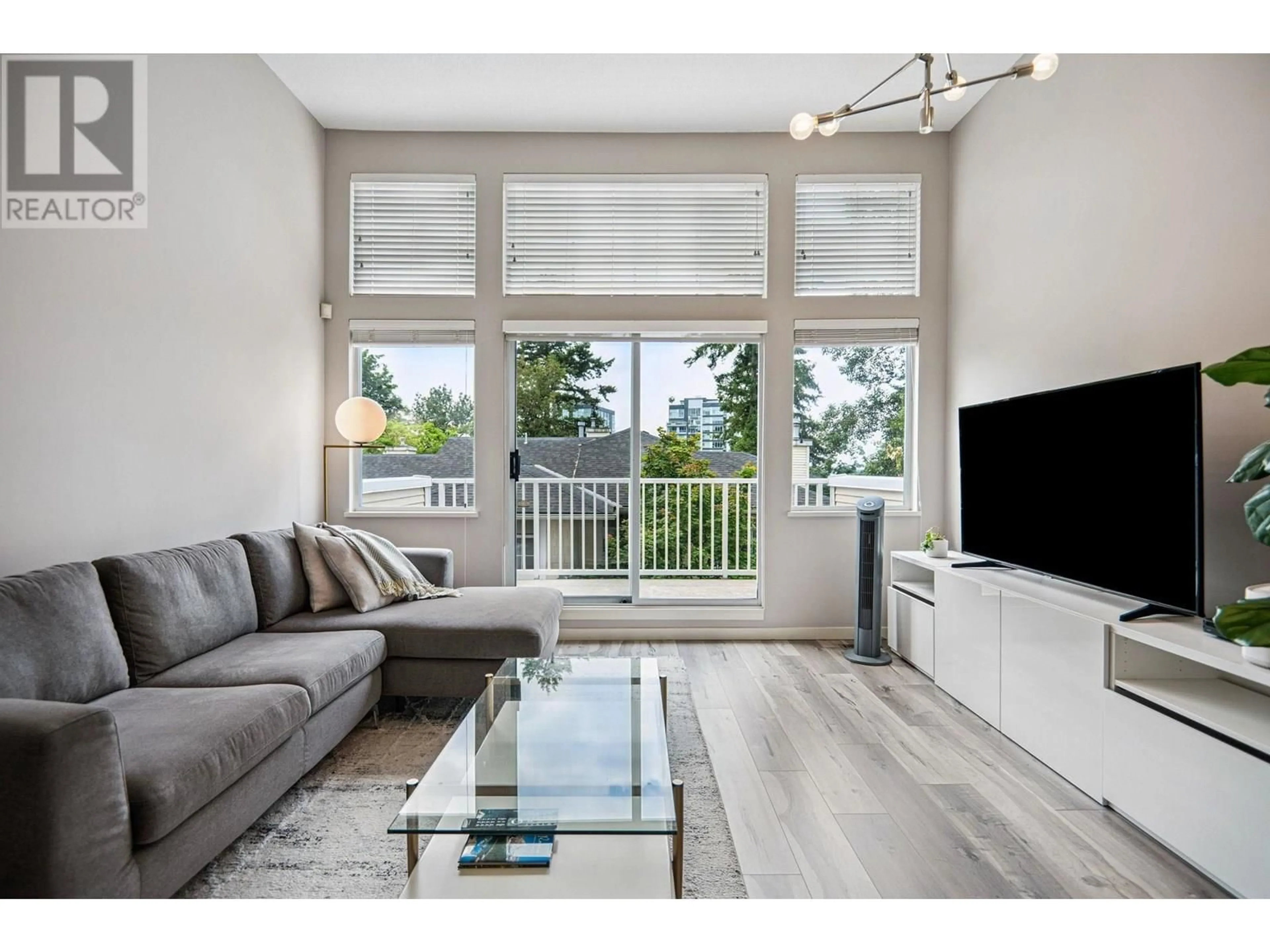 Living room with furniture, wood/laminate floor for 1 - 3578 WHITNEY PLACE, Vancouver British Columbia V5S4T2
