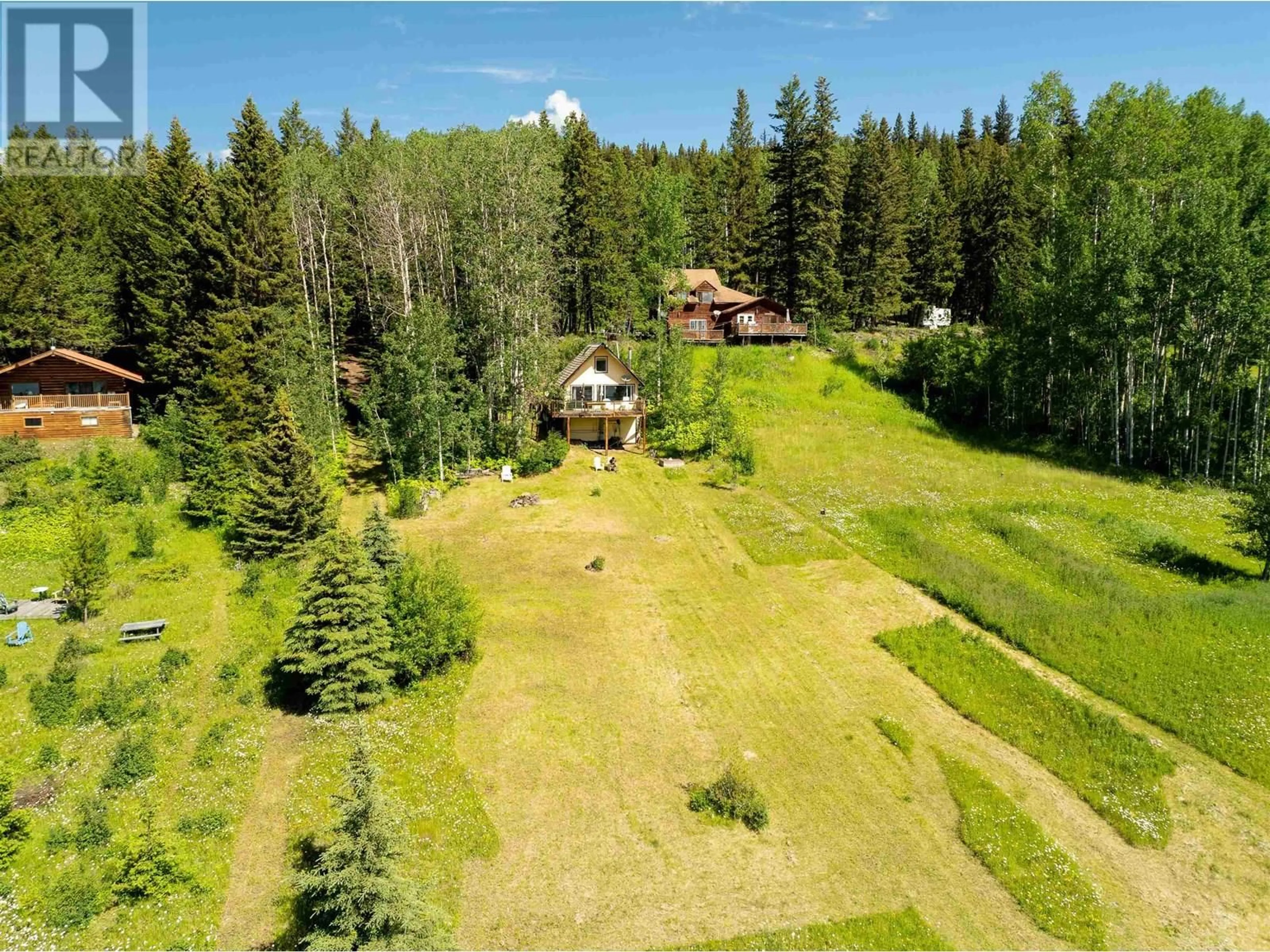 A pic from outside/outdoor area/front of a property/back of a property/a pic from drone, forest/trees view for 7101 NOVETA ROAD, Bridge Lake British Columbia V0K1X2
