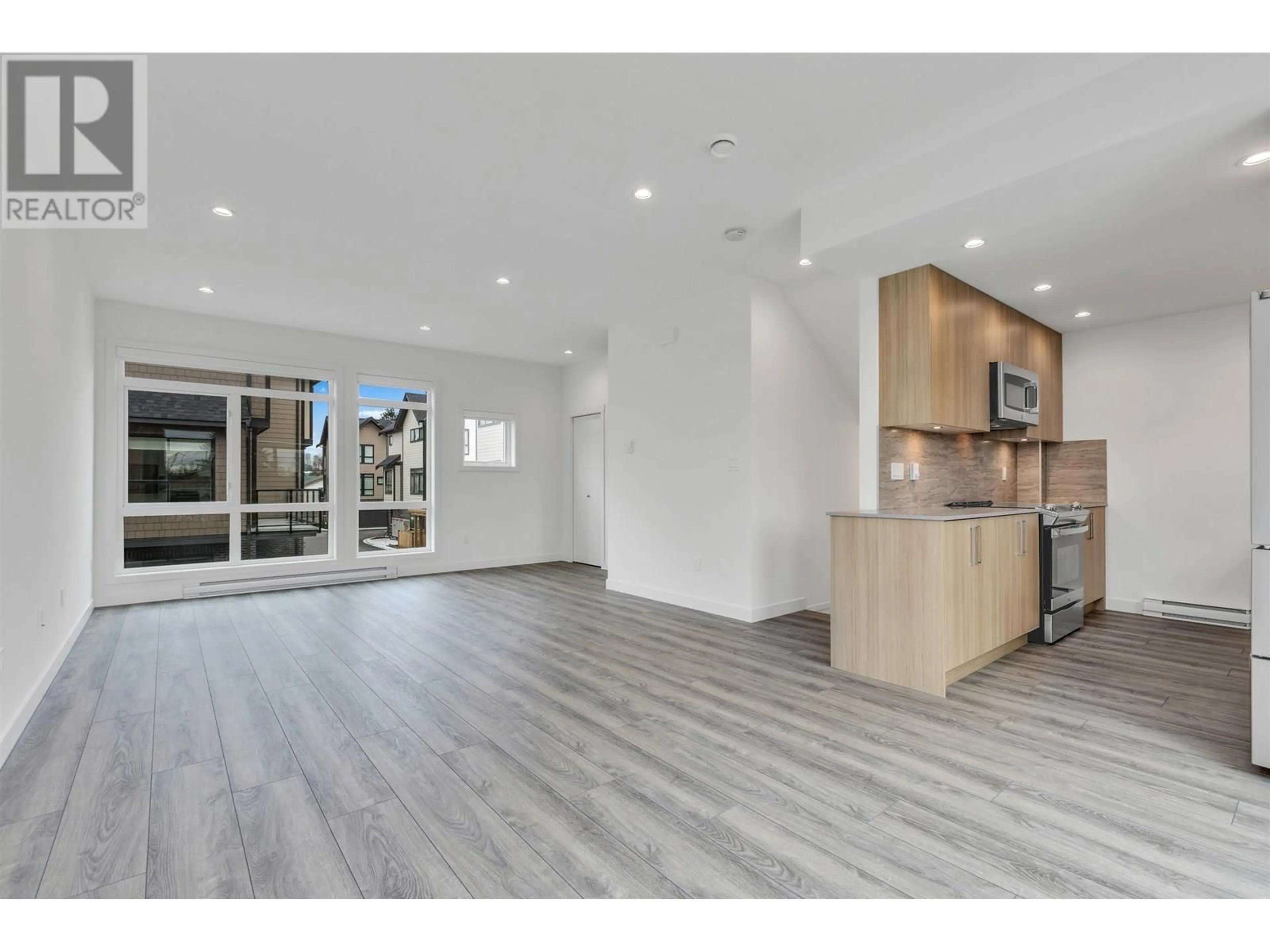 Open concept kitchen, wood/laminate floor for 2 - 4300 THOMPSON ROAD, Richmond British Columbia V6V0C3