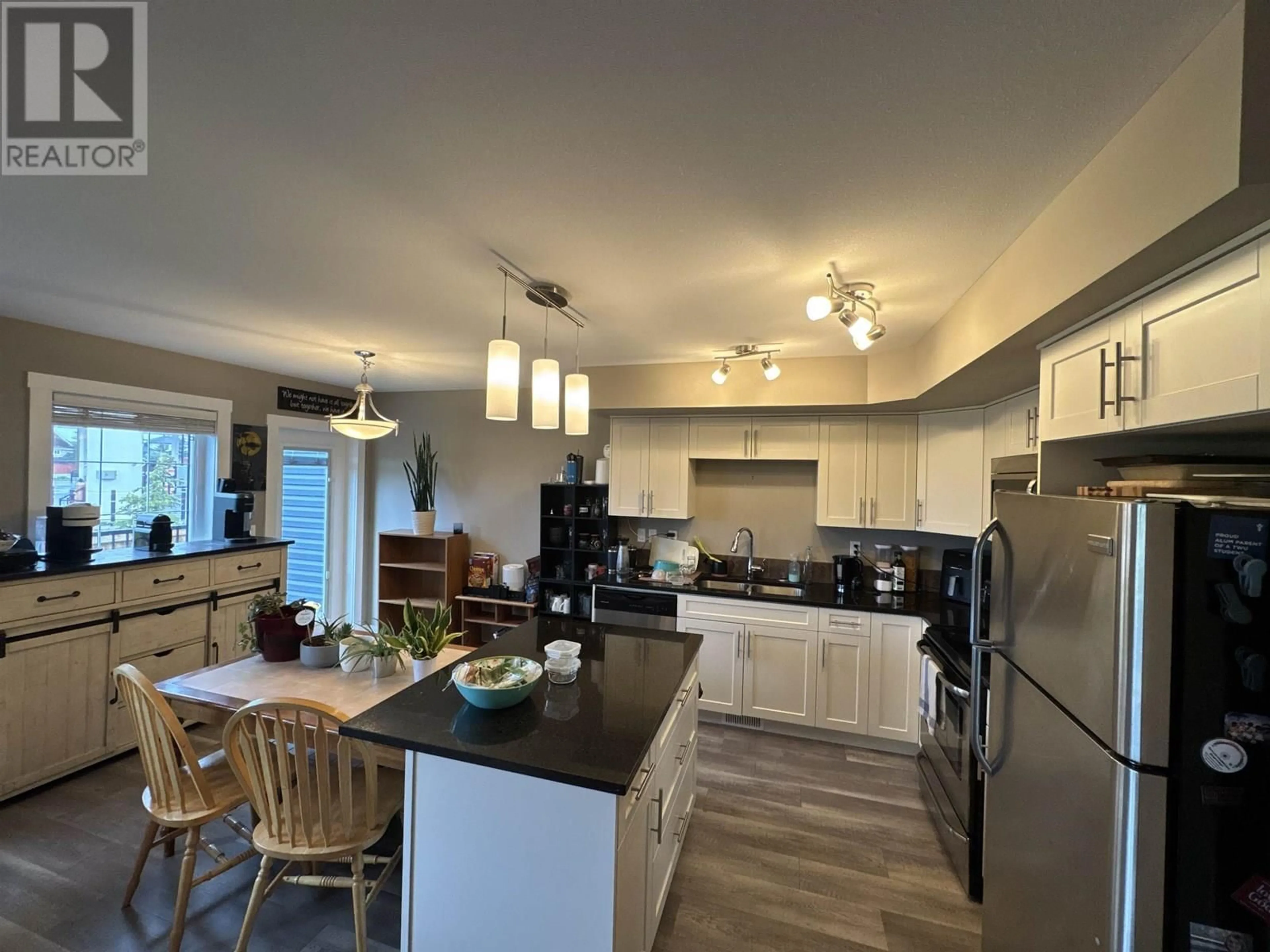 Open concept kitchen, wood/laminate floor for 119 - 10104 114A AVENUE, Fort St. John British Columbia V1J0K5