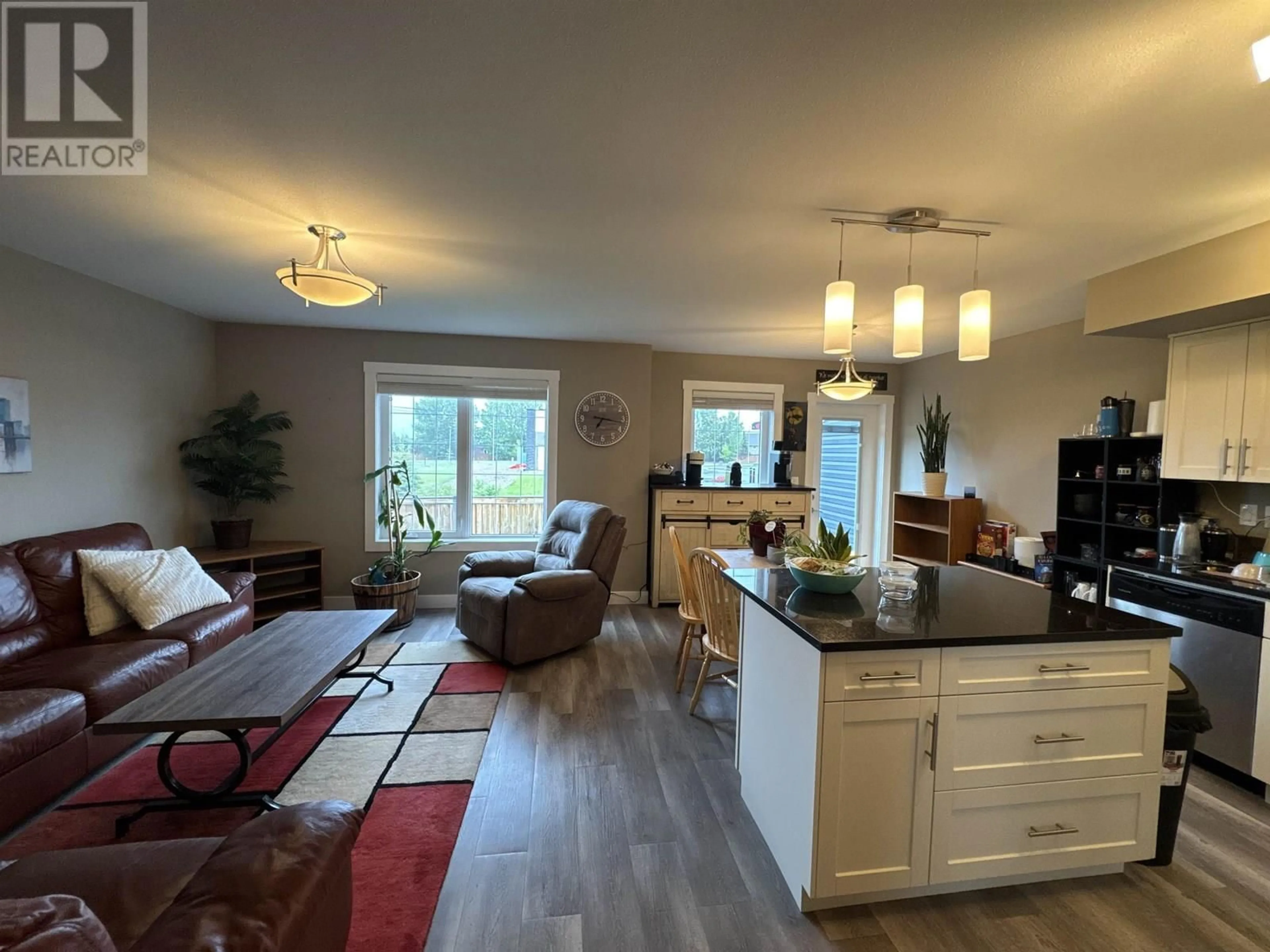 Open concept kitchen, wood/laminate floor for 119 - 10104 114A AVENUE, Fort St. John British Columbia V1J0K5