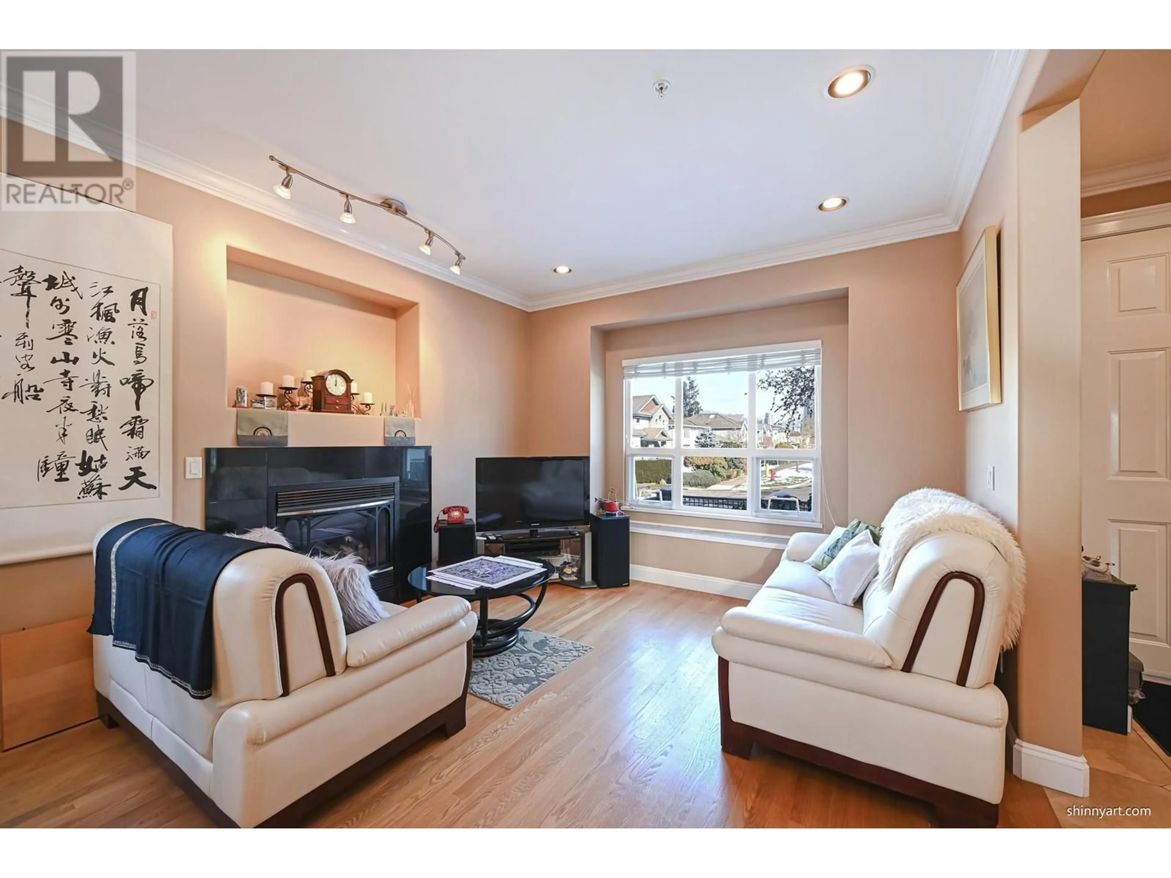 Living room with furniture, wood/laminate floor for 3506 HAIDA DRIVE, Vancouver British Columbia V5M3Z4