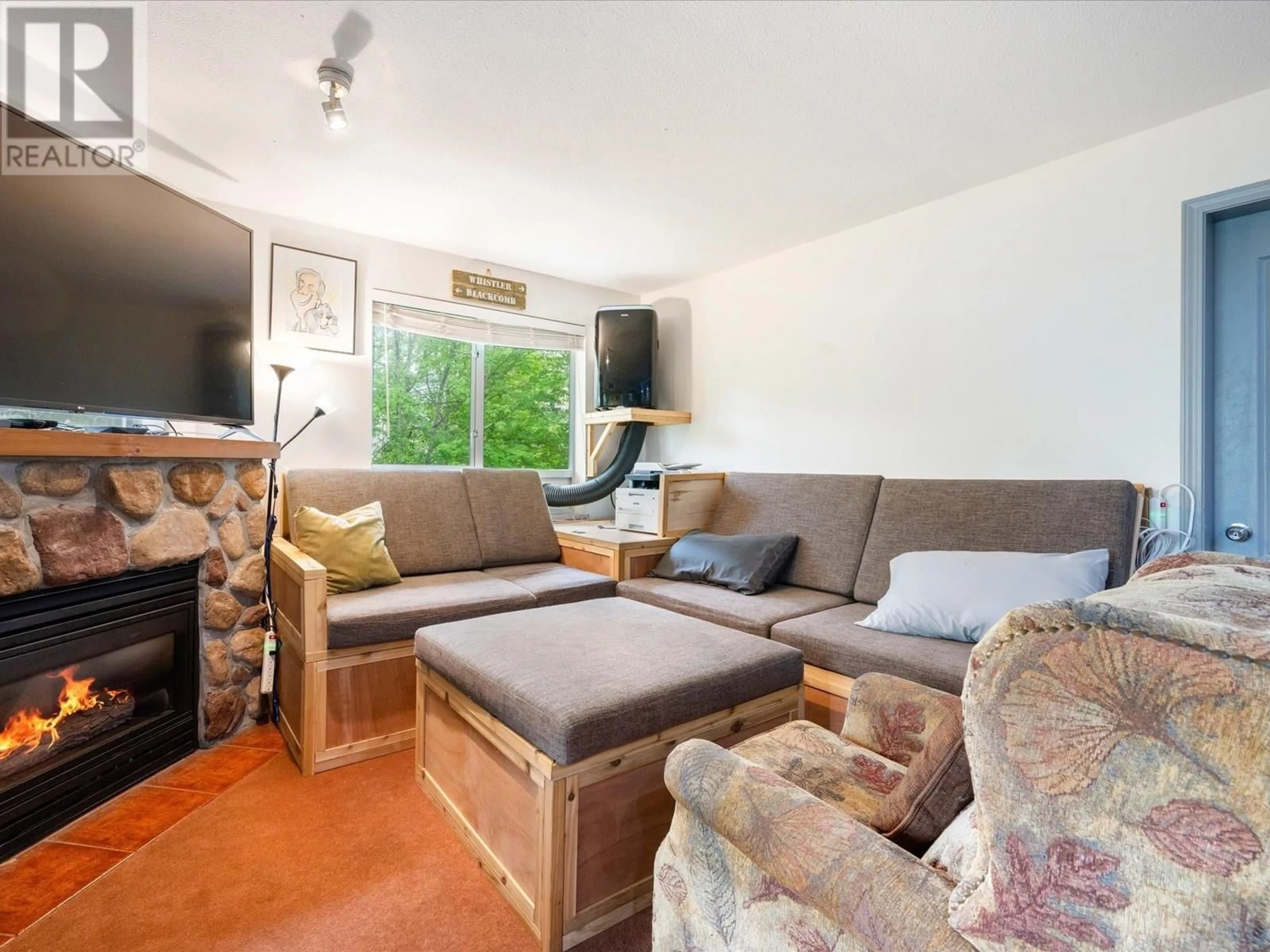 Living room with furniture, wood/laminate floor for 304 - 4314 MAIN STREET, Whistler British Columbia V8E1A8