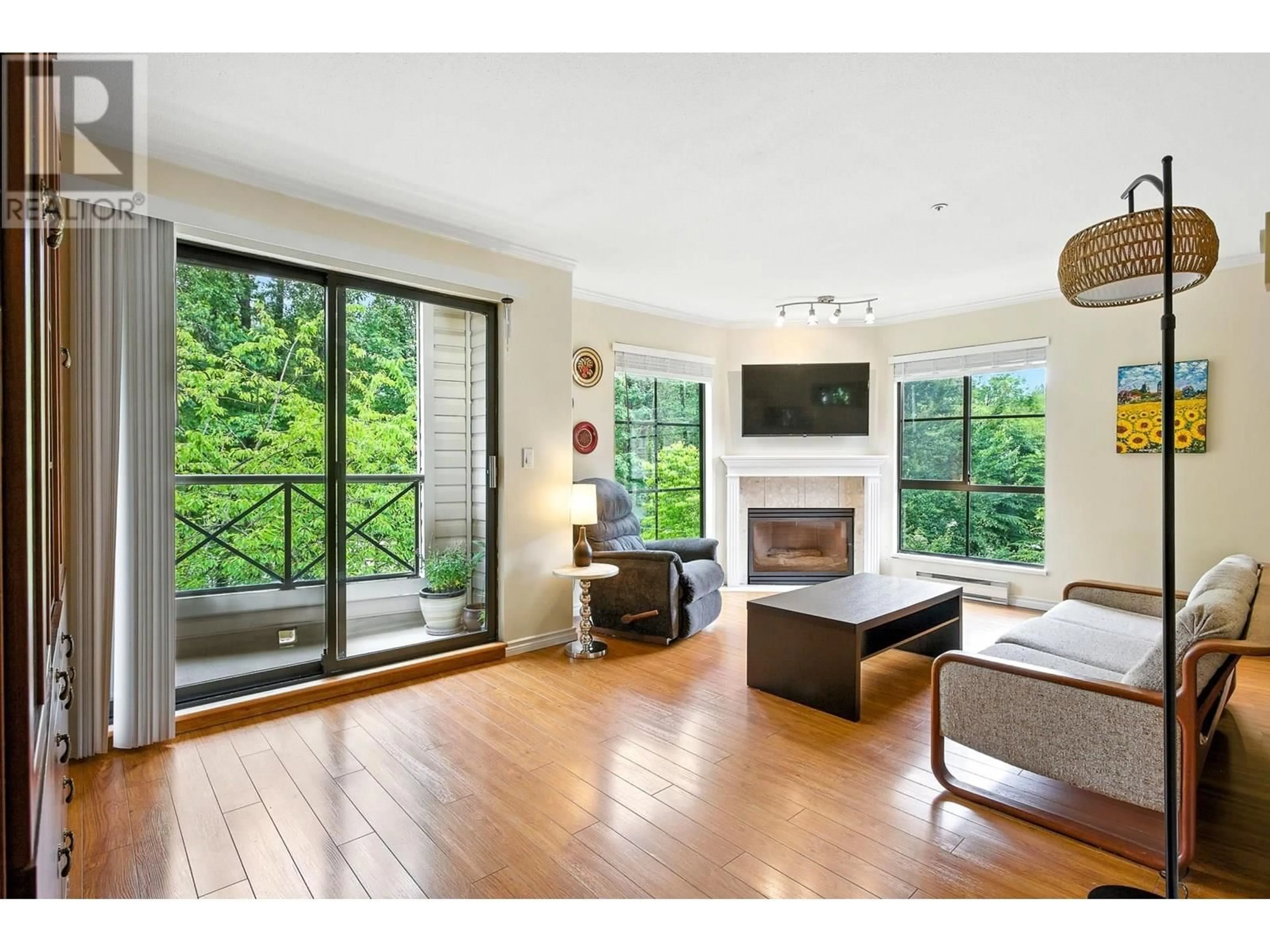 Living room with furniture, wood/laminate floor for 303 - 2357 WHYTE AVENUE, Port Coquitlam British Columbia V3C2A3