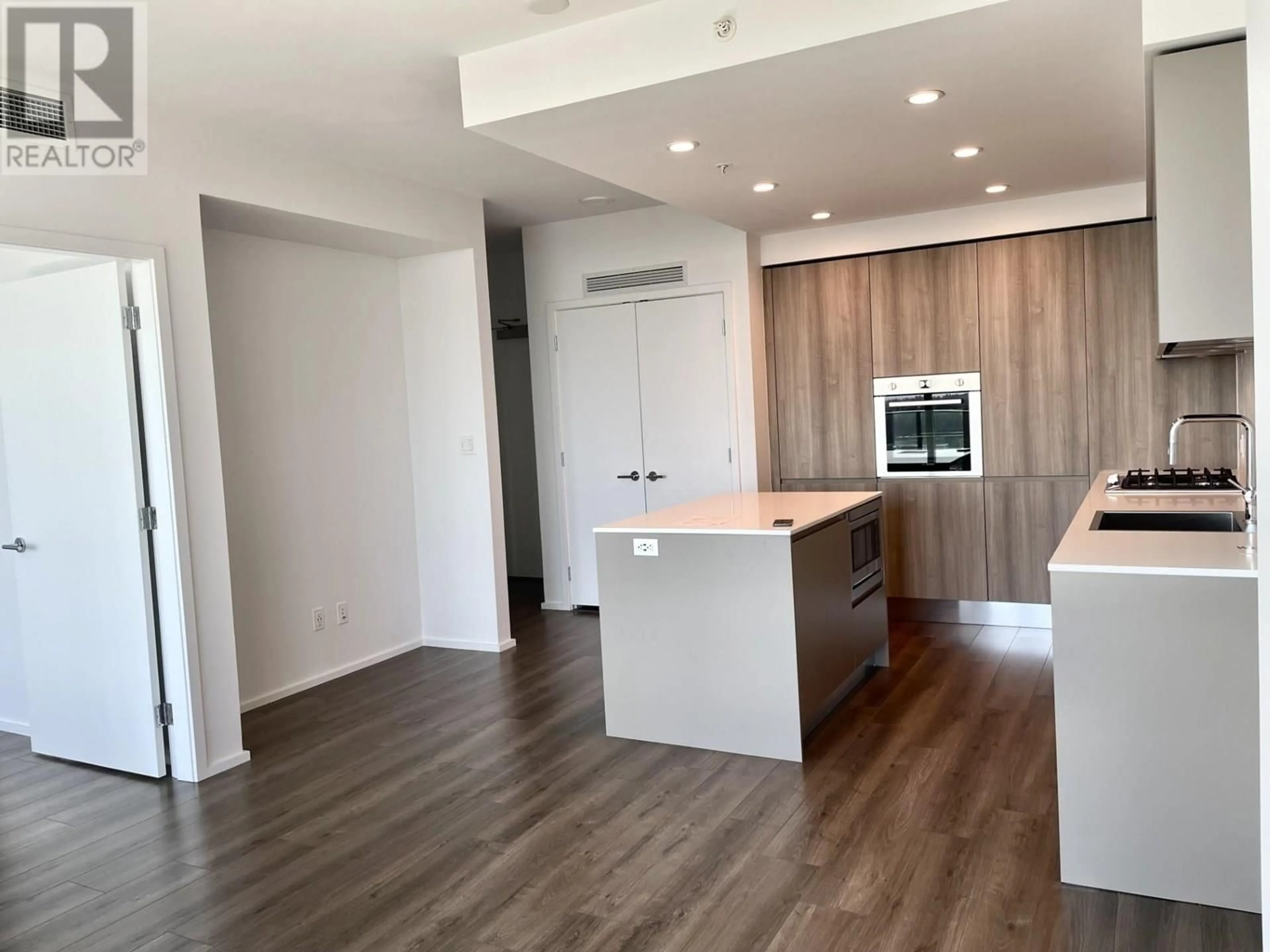 Open concept kitchen, wood/laminate floor for 4102 - 3809 EVERGREEN PLACE, Burnaby British Columbia V3J0M1