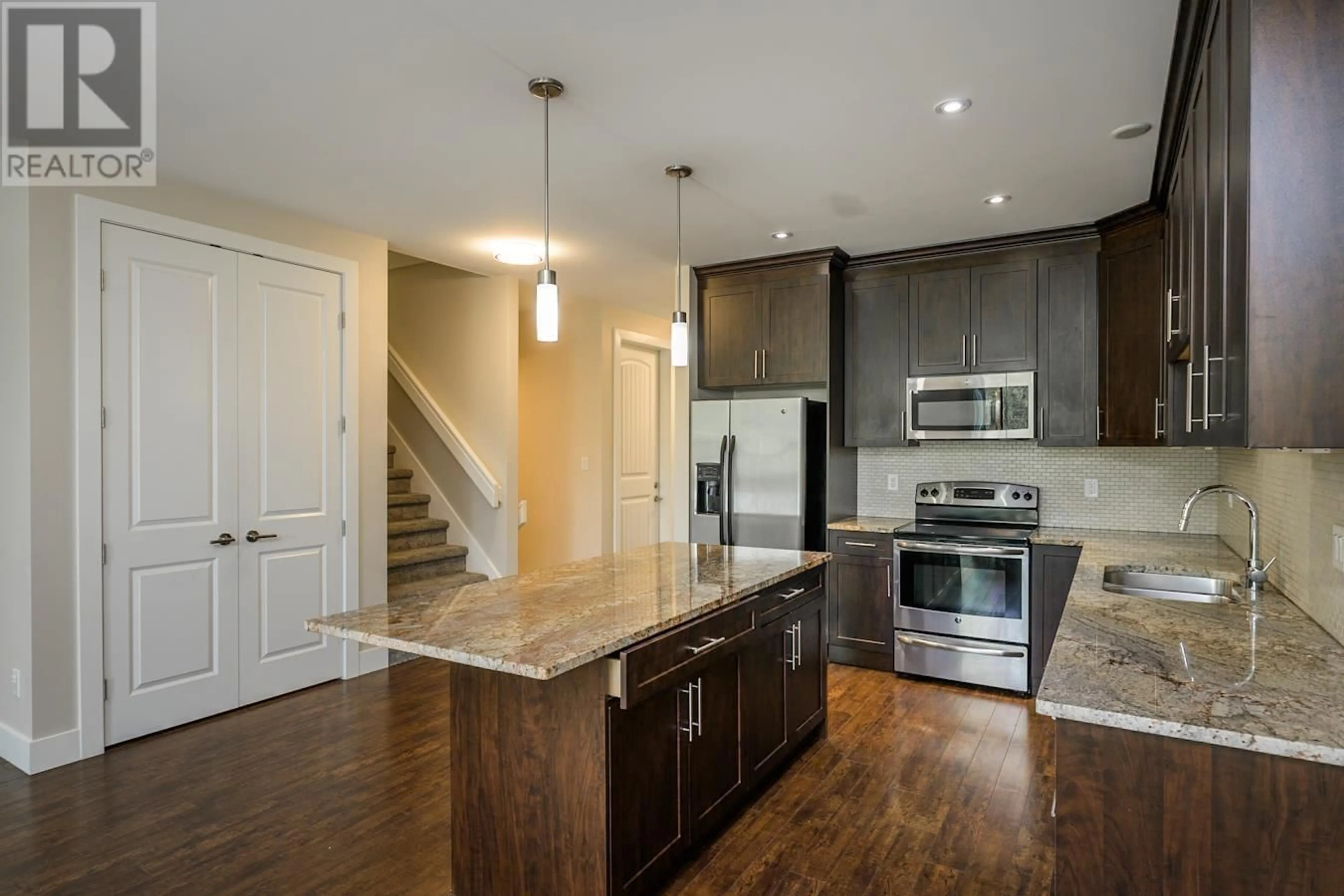 Open concept kitchen, wood/laminate floor for 105 - 6713 WESTMOUNT DRIVE, Prince George British Columbia V2N6R3