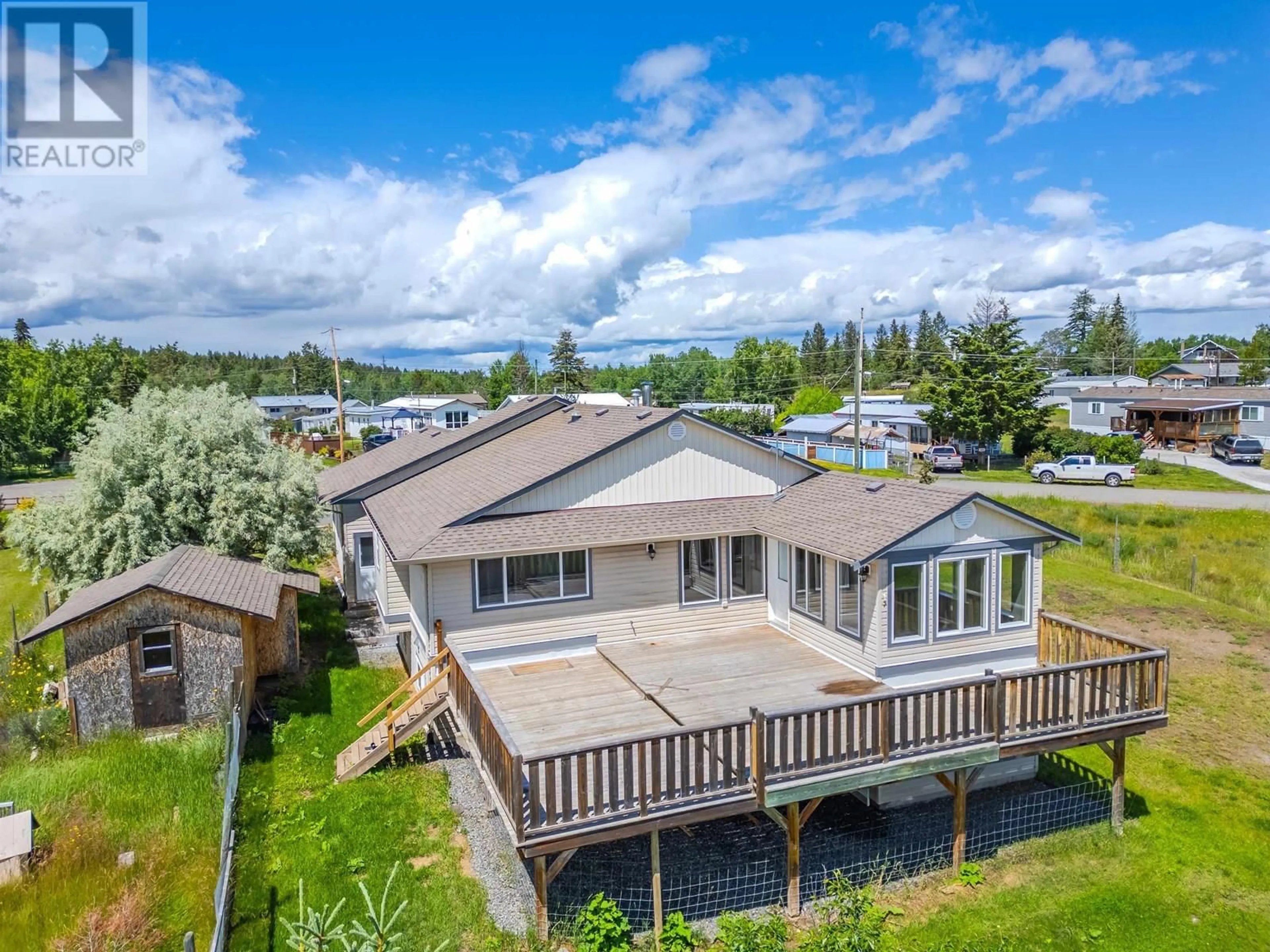 A pic from outside/outdoor area/front of a property/back of a property/a pic from drone, water/lake/river/ocean view for 5526 LAKESIDE COURT, 103 Mile House British Columbia V0K2E1