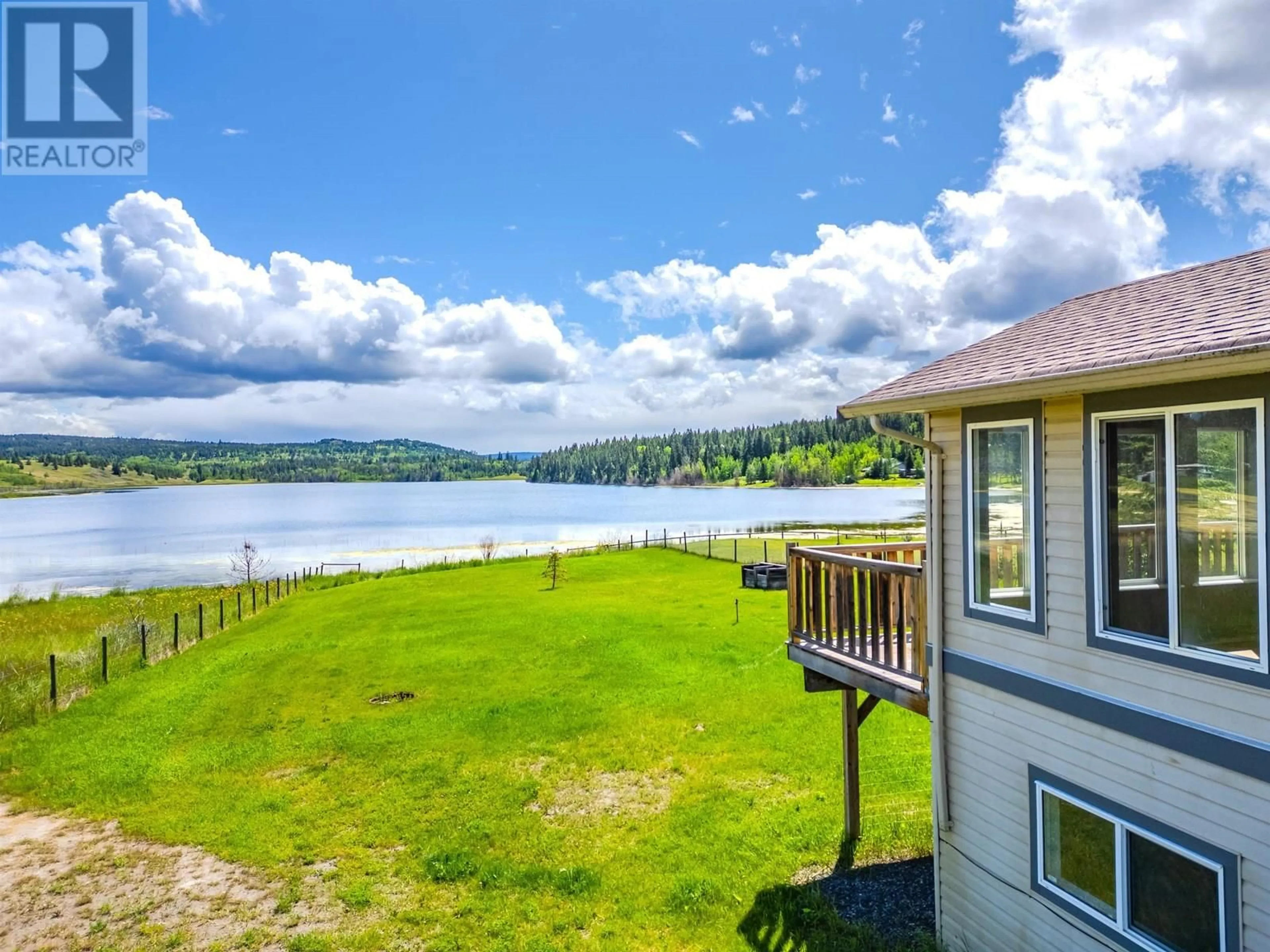 A pic from outside/outdoor area/front of a property/back of a property/a pic from drone, water/lake/river/ocean view for 5526 LAKESIDE COURT, 103 Mile House British Columbia V0K2E1