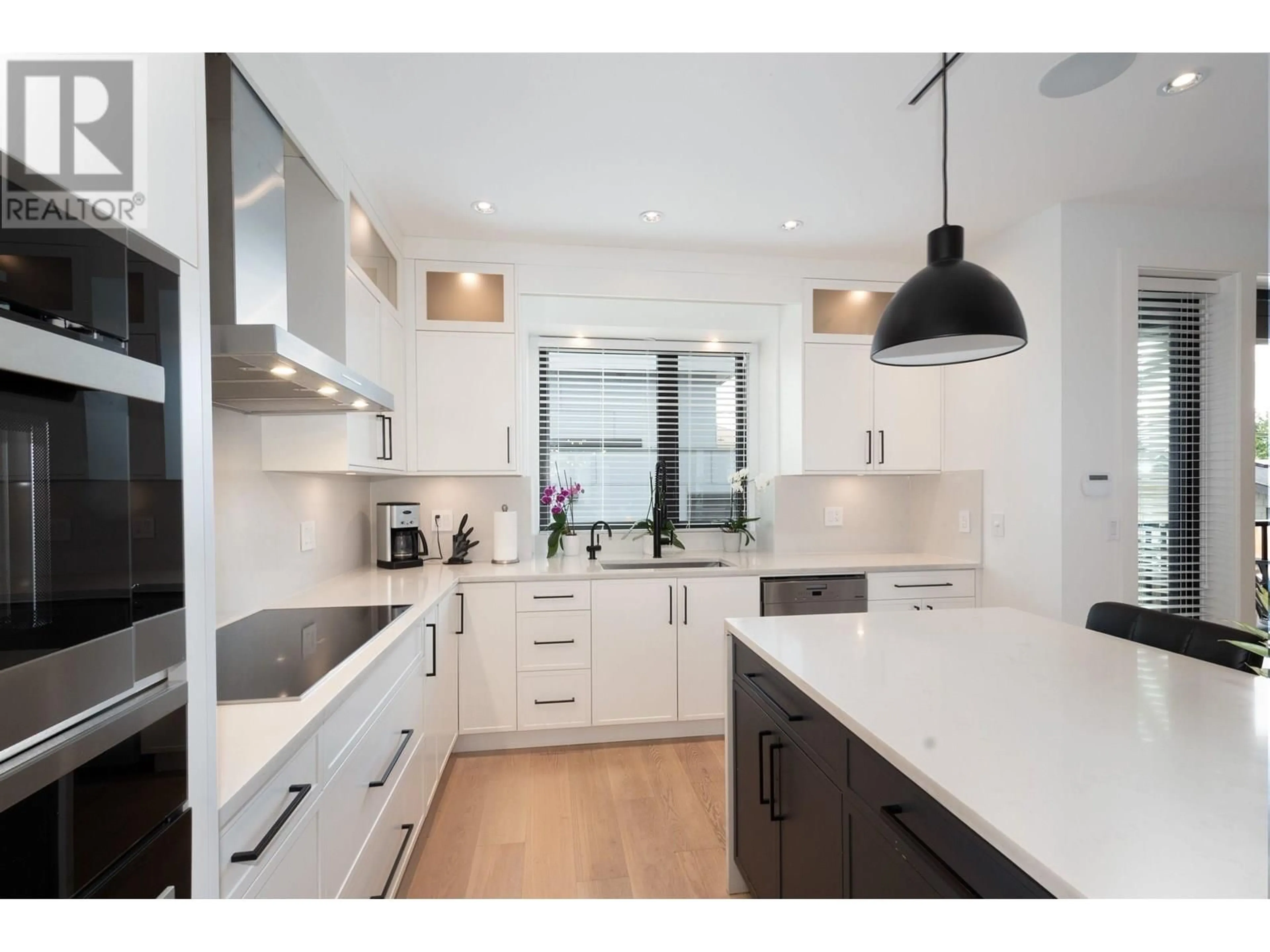 Contemporary kitchen, wood/laminate floor for 2765 27TH AVENUE, Vancouver British Columbia V5R1N4