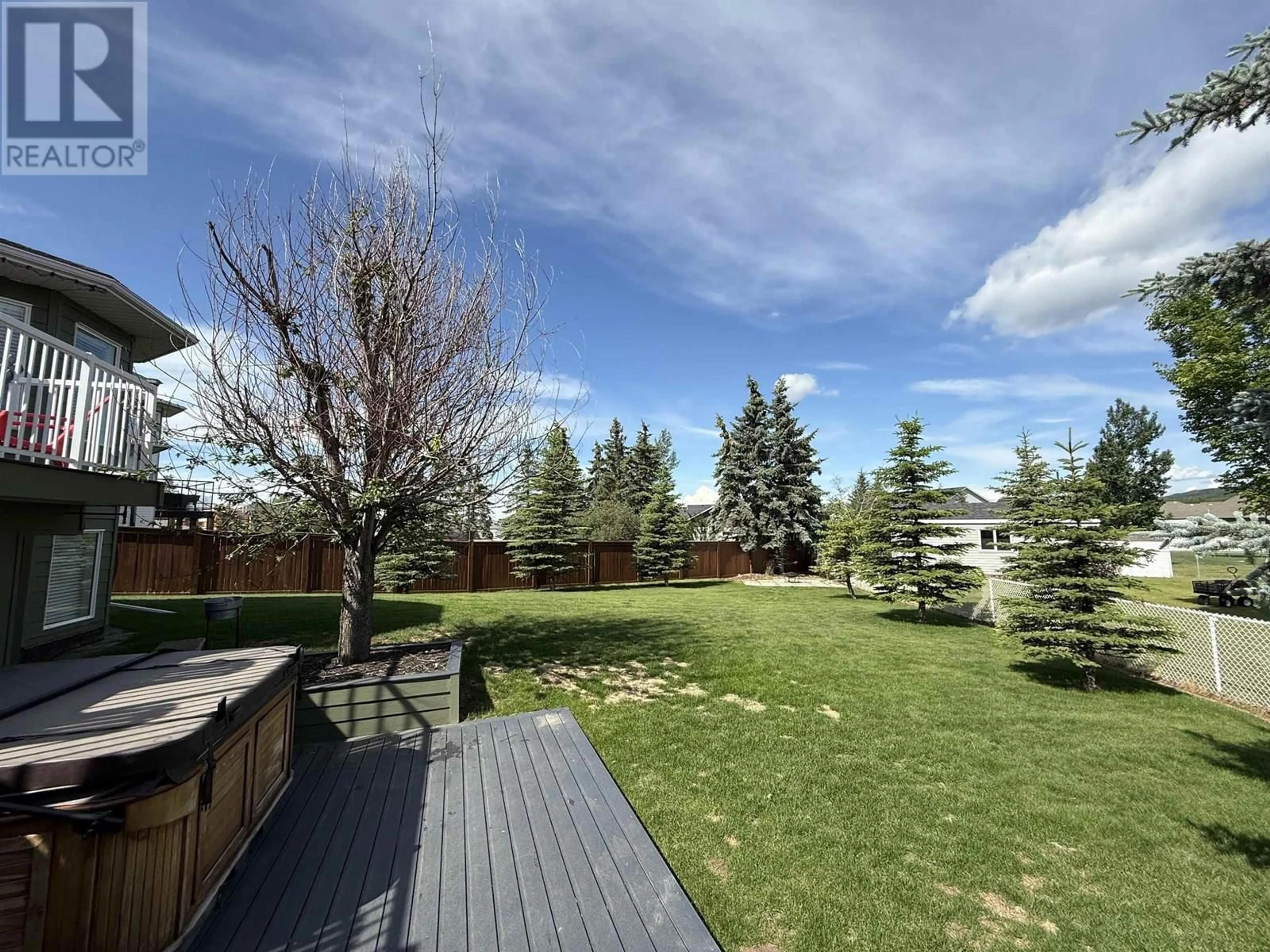 A pic from outside/outdoor area/front of a property/back of a property/a pic from drone, forest/trees view for 10912 112 AVENUE, Fort St. John British Columbia V1J6H1