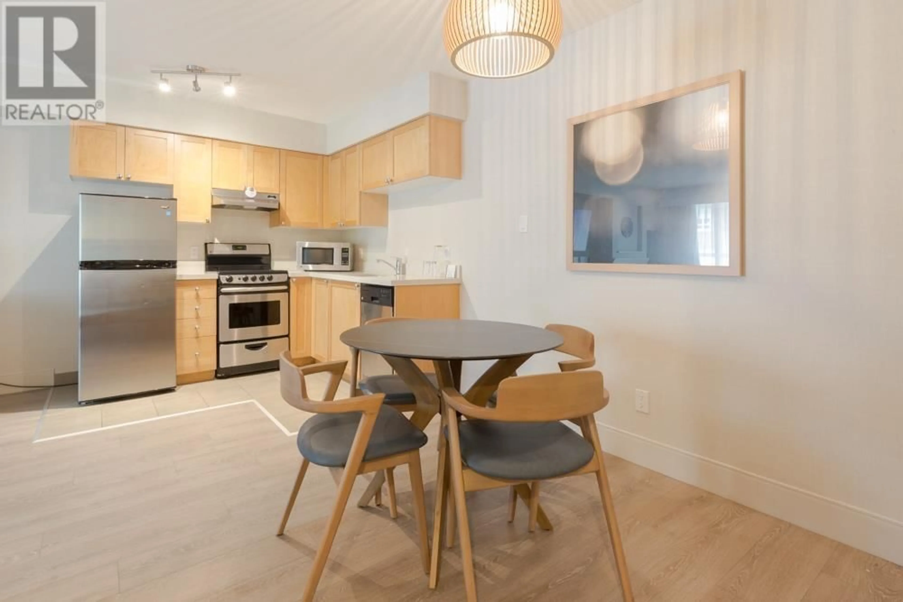 Open concept kitchen, wood/laminate floor for 1210/12 - 4308 MAIN STREET, Whistler British Columbia V8E1A9