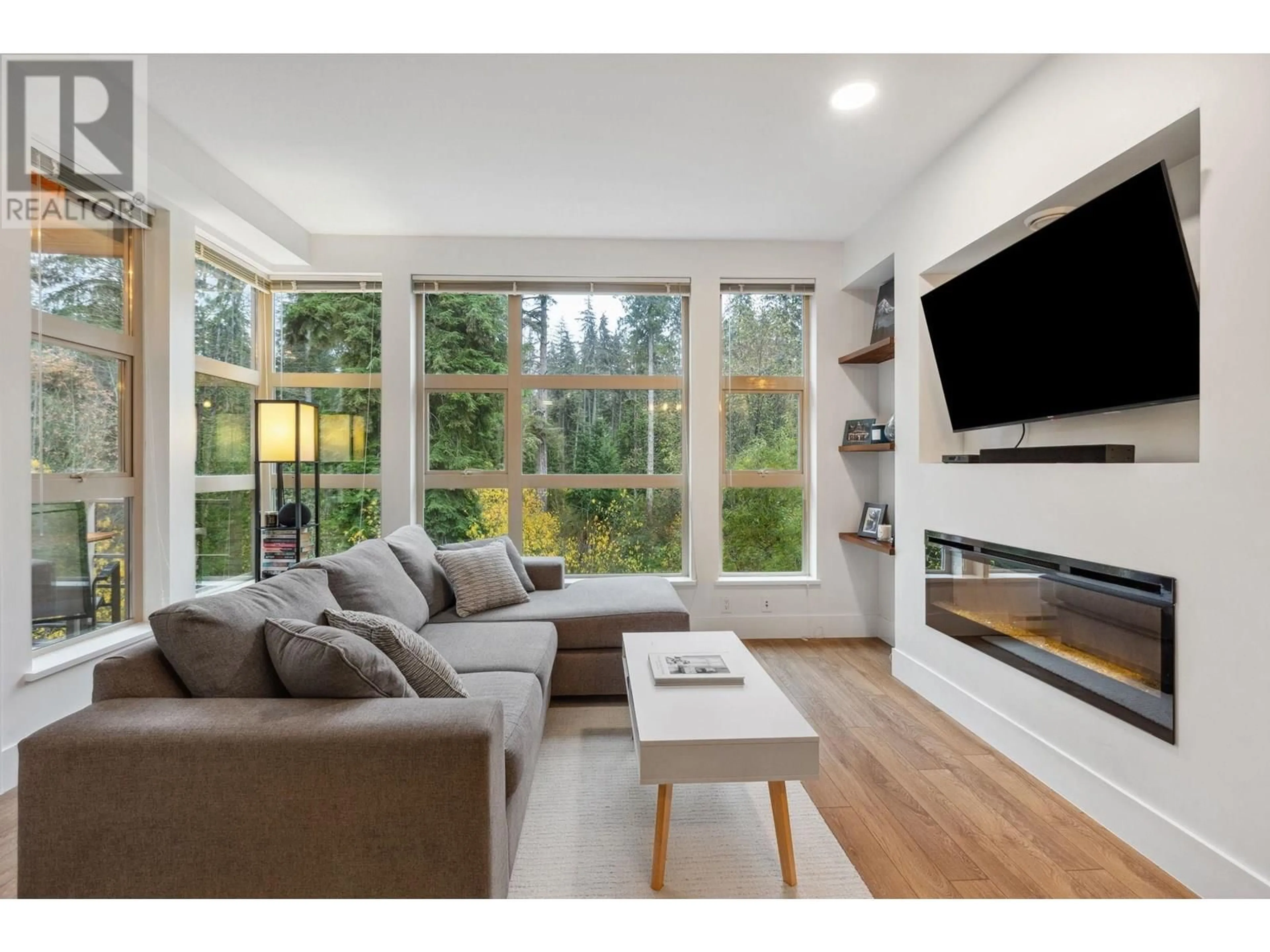 Living room with furniture, wood/laminate floor for 422 - 3606 ALDERCREST DRIVE, North Vancouver British Columbia V7G0A3