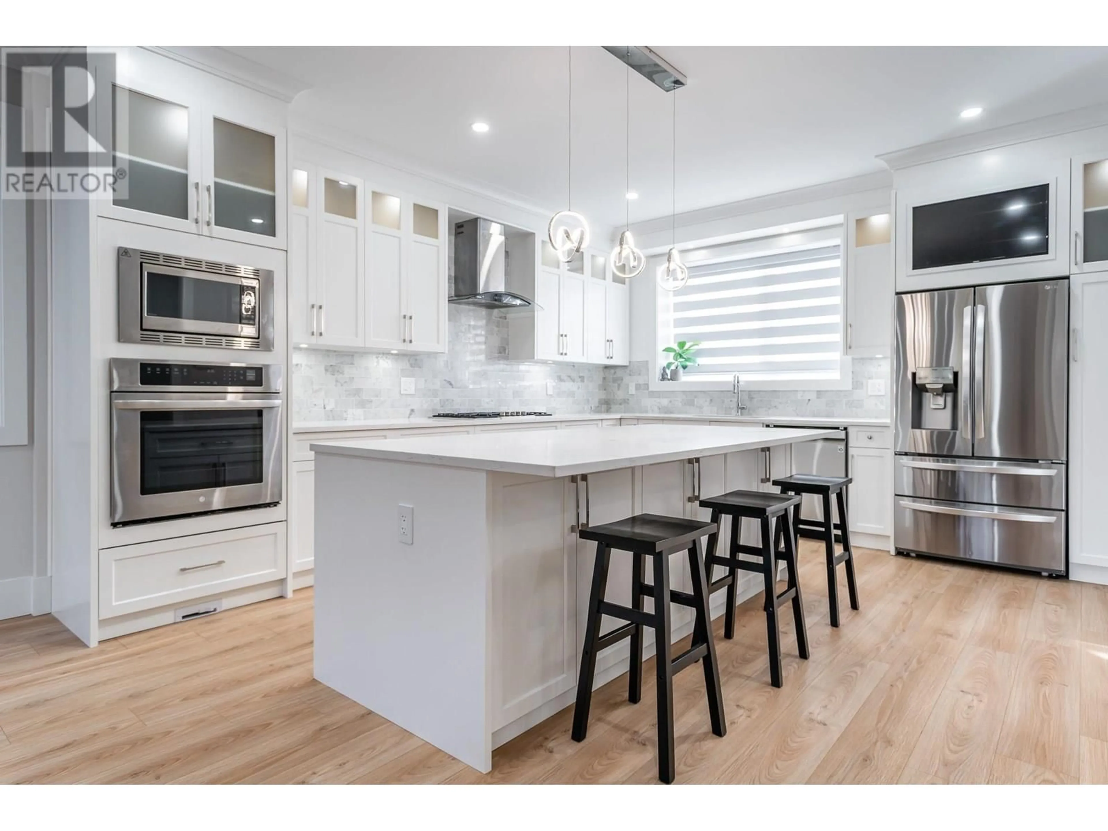 Open concept kitchen, wood/laminate floor for 3409 VICTORIA DRIVE, Coquitlam British Columbia V3B2V5