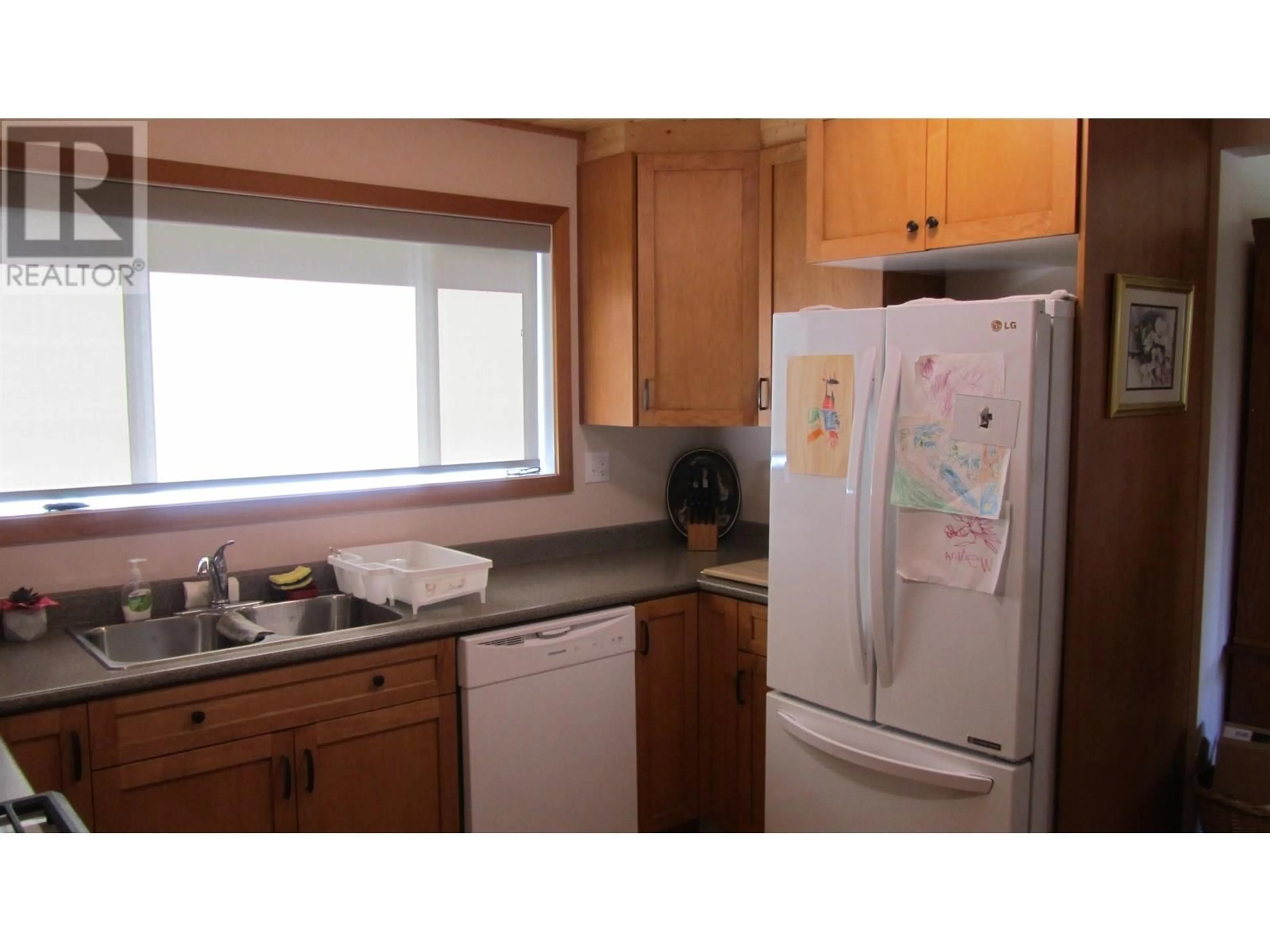Standard kitchen, wood/laminate floor for 5258 MACKAY CRESCENT, 108 Mile Ranch British Columbia V0K2Z0