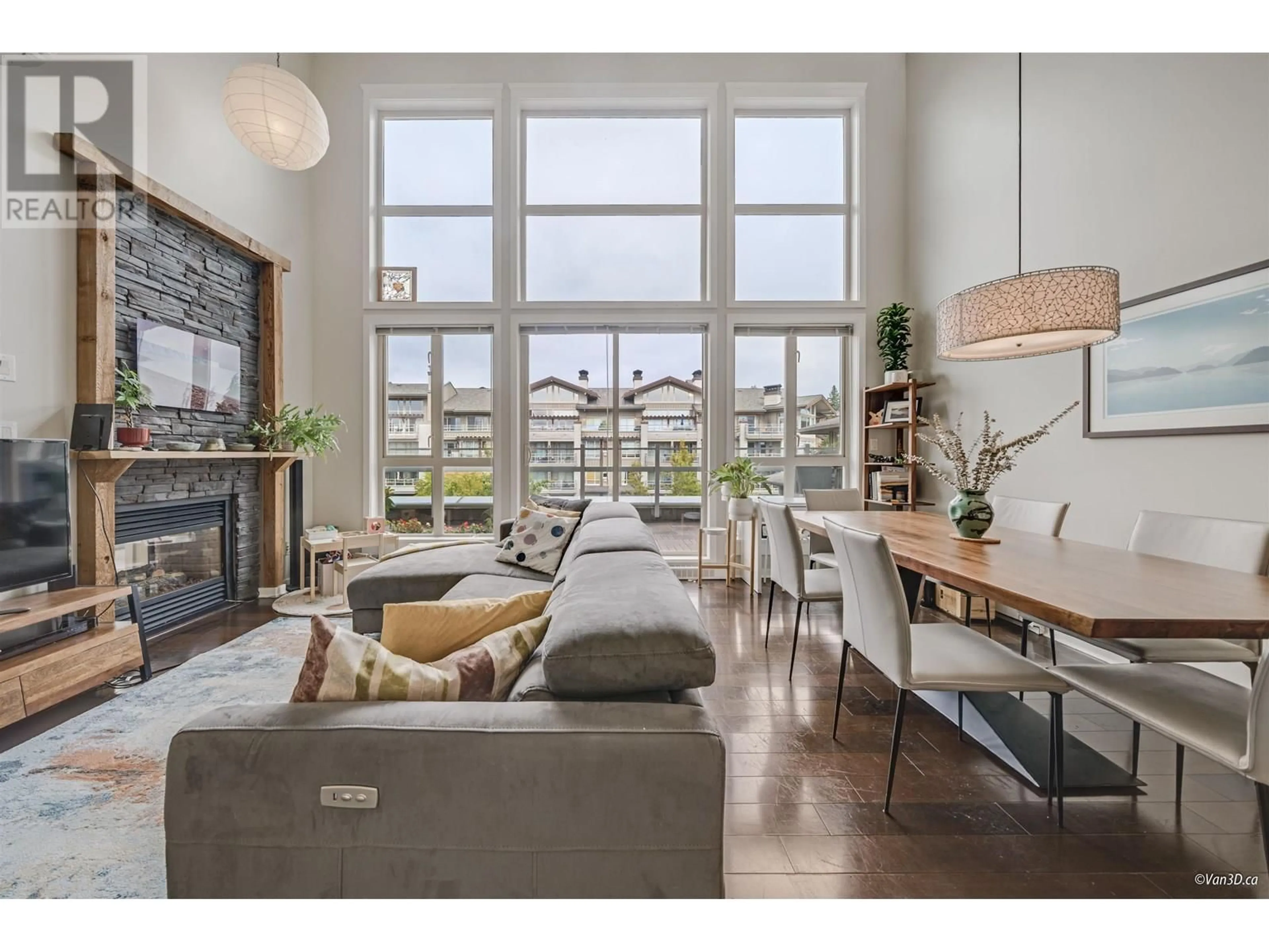 Living room with furniture, wood/laminate floor for 506 - 530 RAVEN WOODS DRIVE, North Vancouver British Columbia V7G2T5