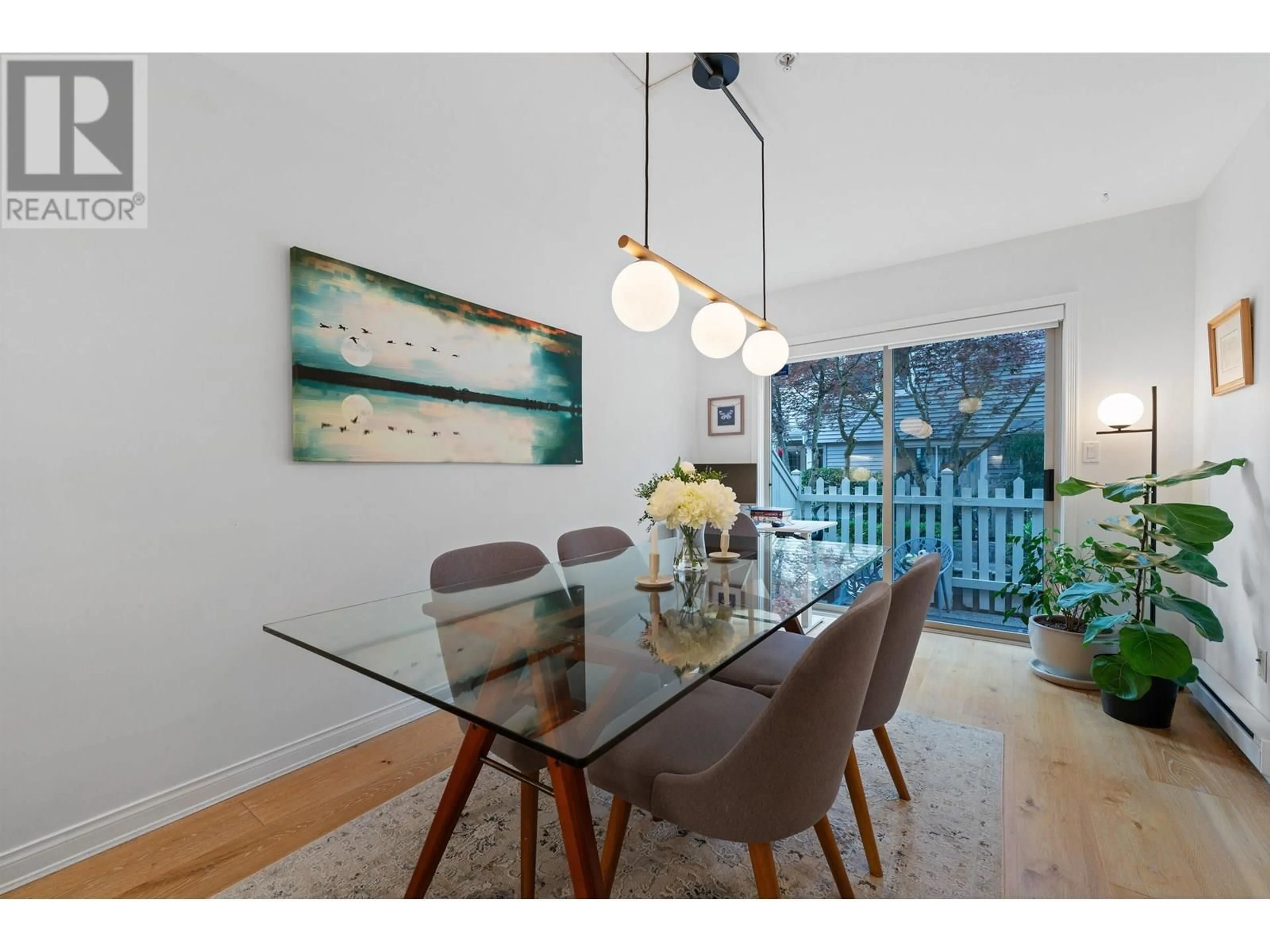 Dining room, wood/laminate floor for 10 - 222 5TH STREET, North Vancouver British Columbia V7L1L7