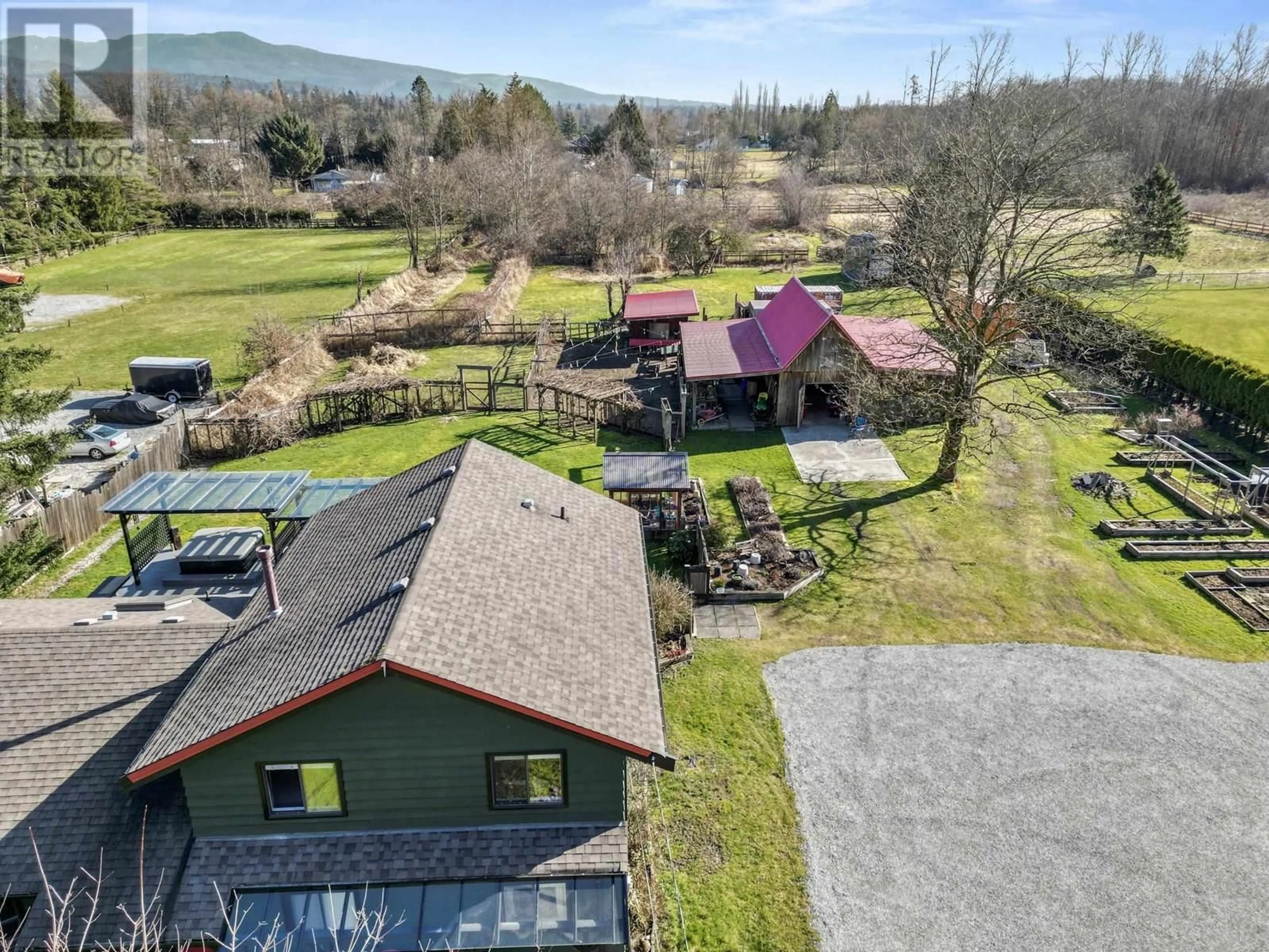 A pic from outside/outdoor area/front of a property/back of a property/a pic from drone, mountain view for 12730 216 STREET, Maple Ridge British Columbia V2X7J9