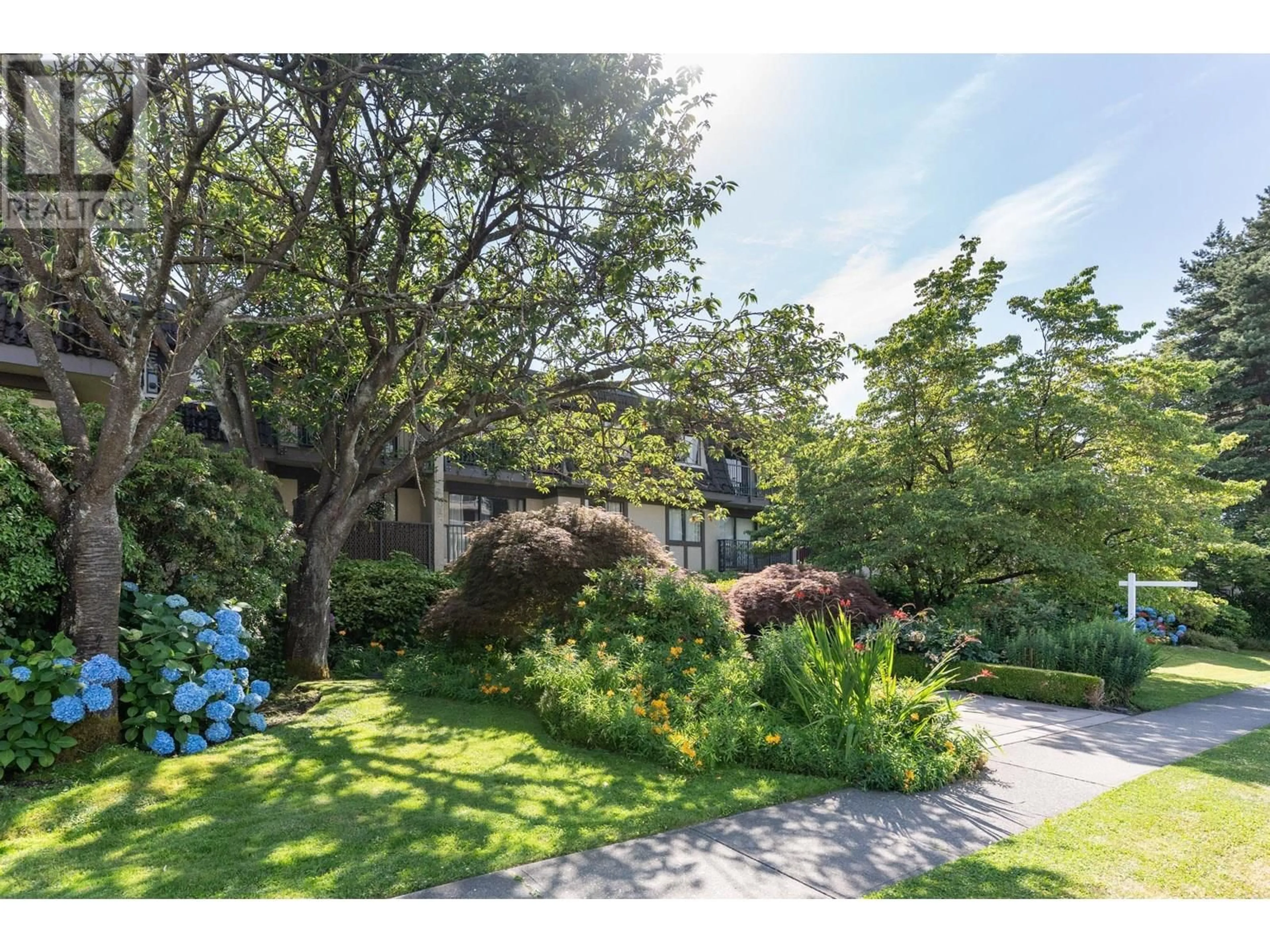 A pic from outside/outdoor area/front of a property/back of a property/a pic from drone, street for 205 - 307 W 2ND STREET, Vancouver British Columbia V7M1E2