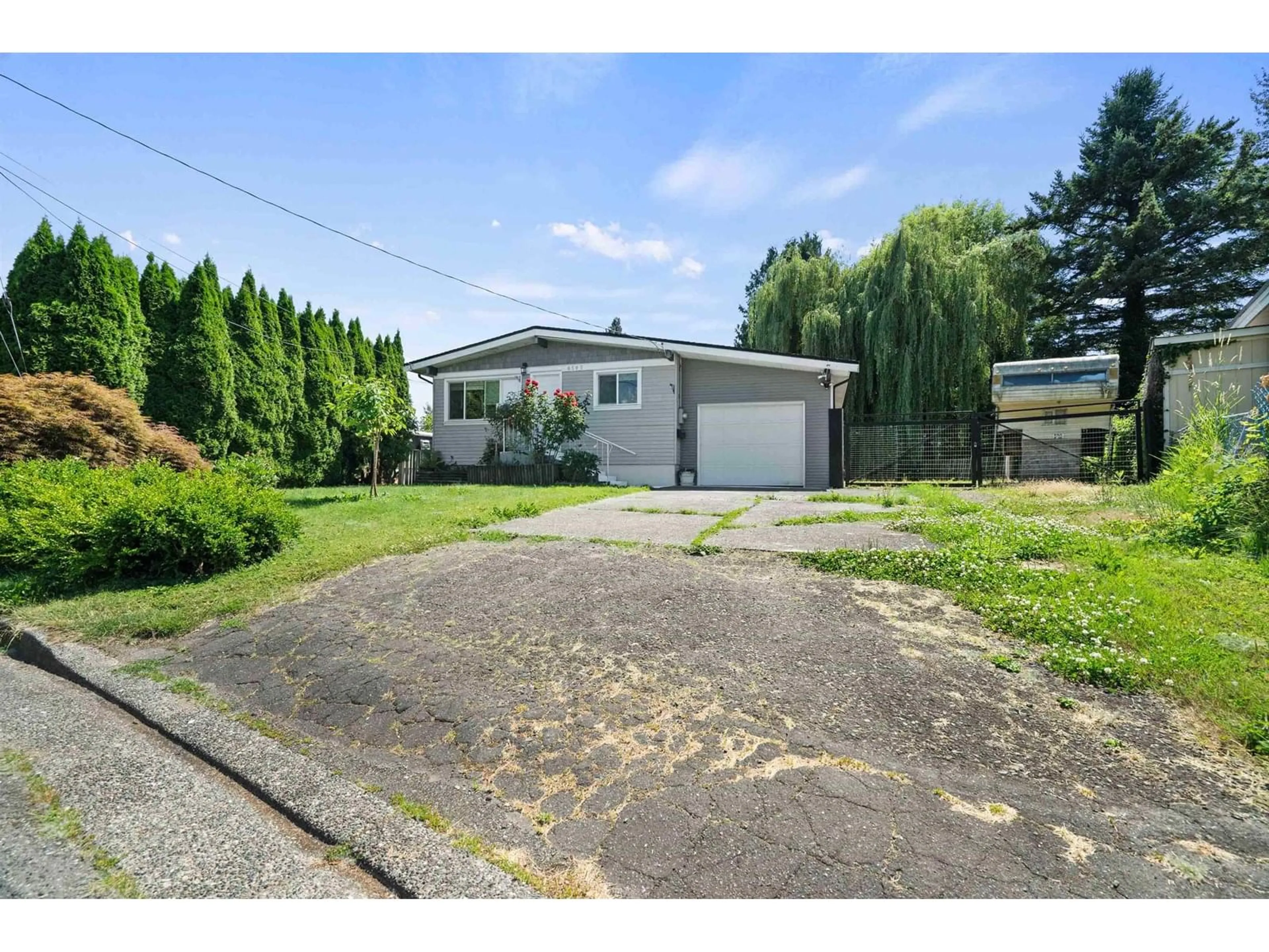 A pic from outside/outdoor area/front of a property/back of a property/a pic from drone, street for 8505 NORMAN CRESCENT, Chilliwack British Columbia V2P5C7