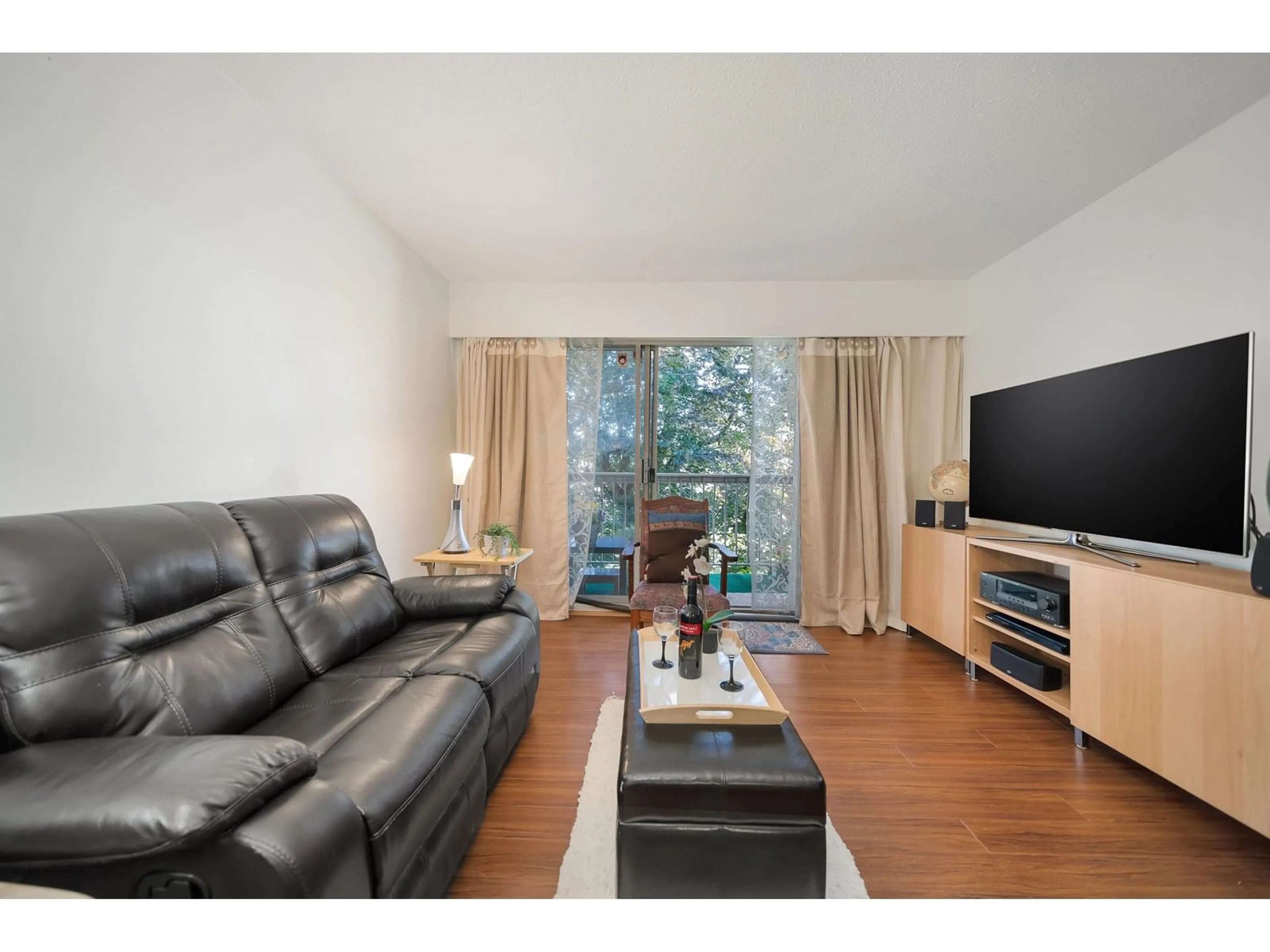 Living room with furniture, wood/laminate floor for 324 - 11806 88, Delta British Columbia V4C3C5