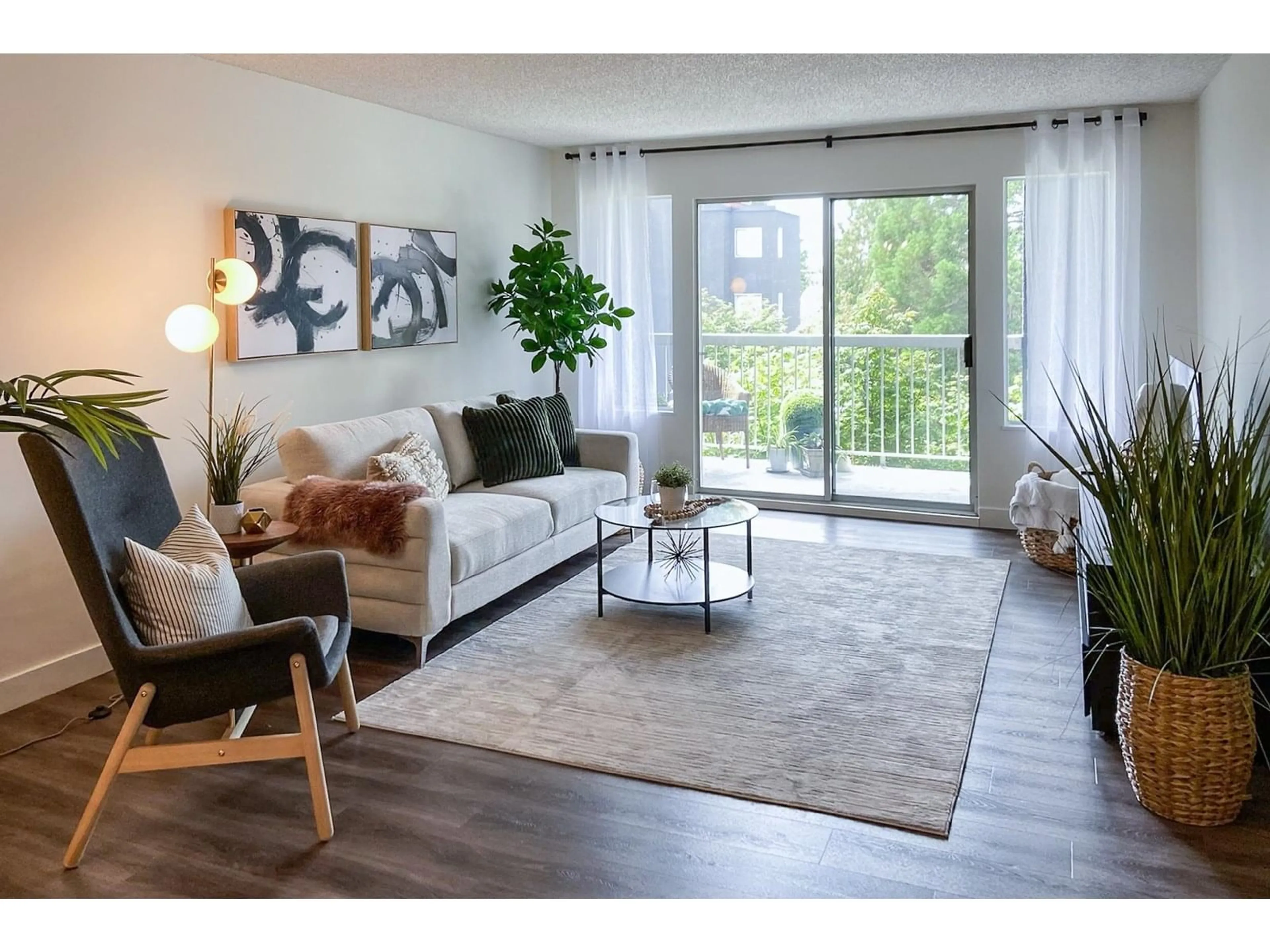 Living room with furniture, wood/laminate floor for 202 - 5700 200, Langley British Columbia V3A7S6