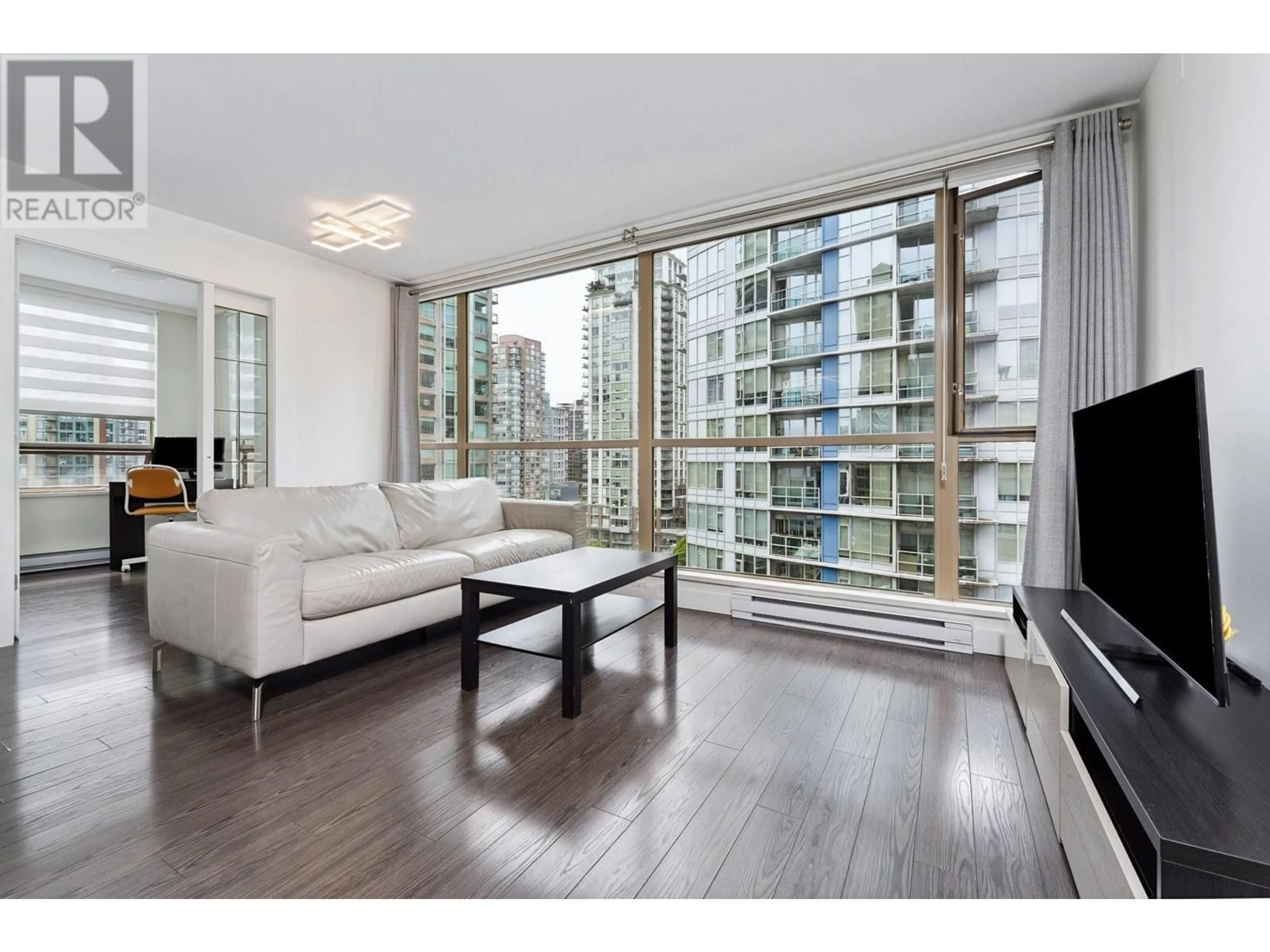 Living room with furniture, wood/laminate floor for 1303 - 822 HOMER STREET, Vancouver British Columbia V6B6M3