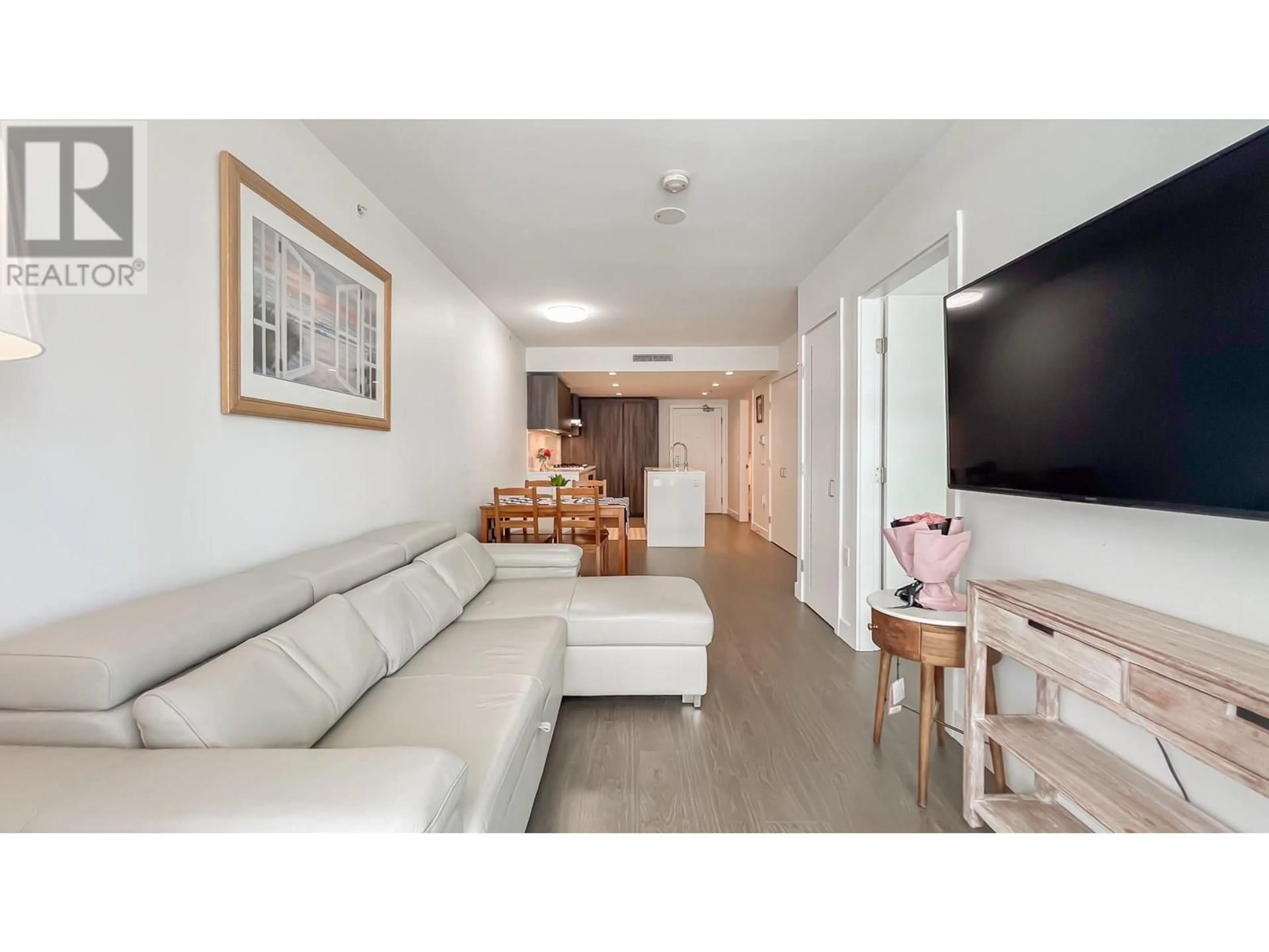 Living room with furniture, wood/laminate floor for 605 - 6320 NO. 3 ROAD, Richmond British Columbia V6Y0L5