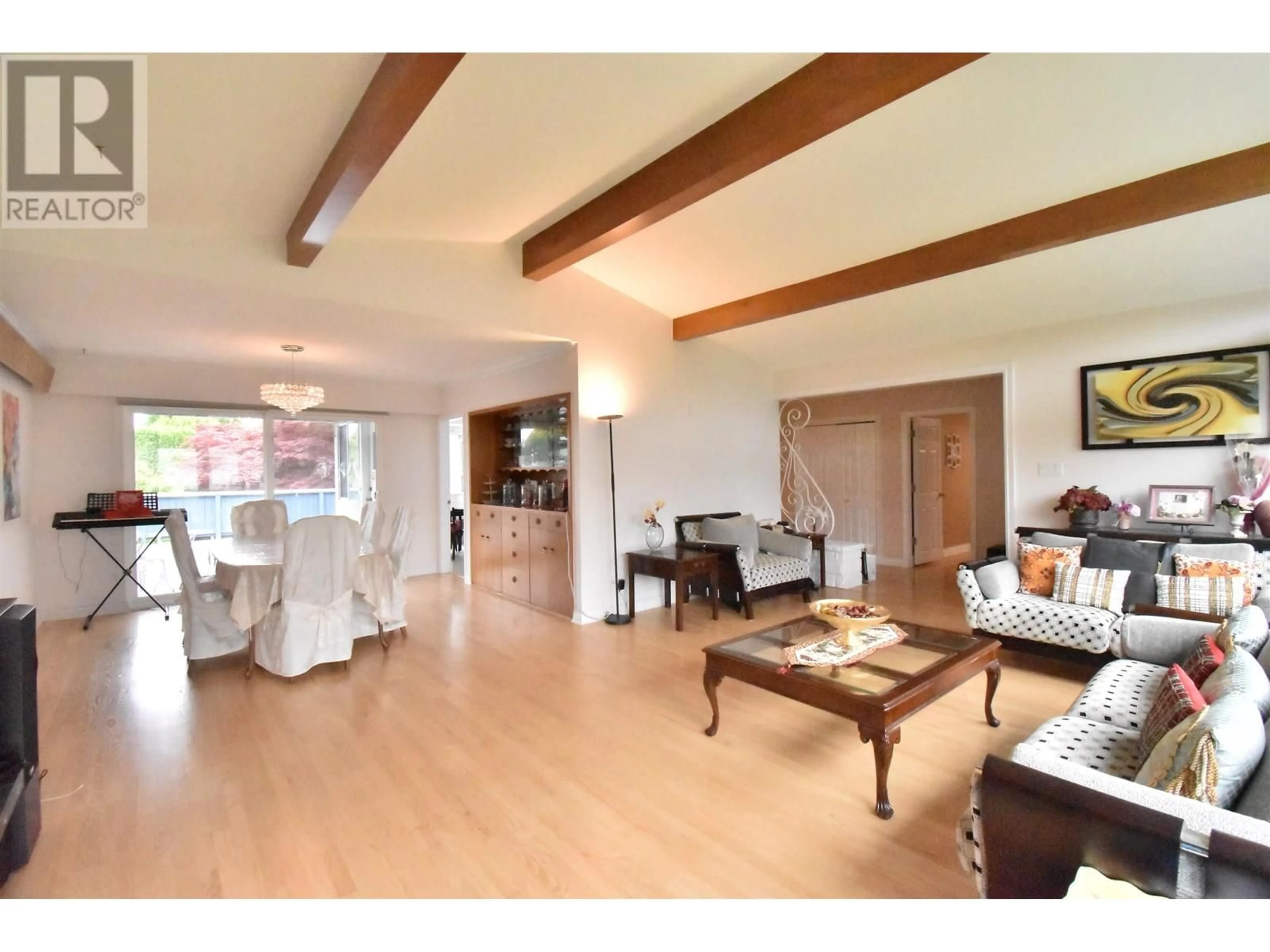 Living room with furniture, wood/laminate floor for 7155 ELMHURST DRIVE, Vancouver British Columbia V5S2X5