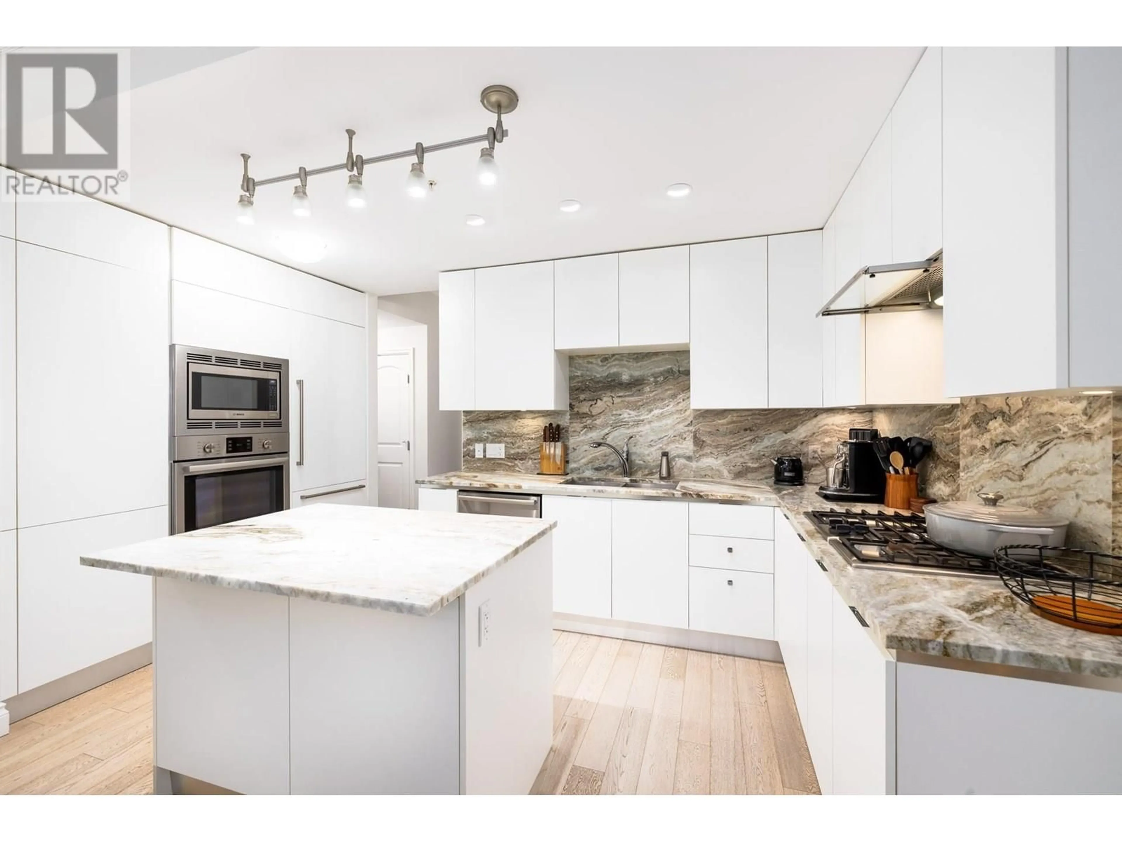 Contemporary kitchen, unknown for 207 - 175 VICTORY SHIP WAY, North Vancouver British Columbia V7L0G1