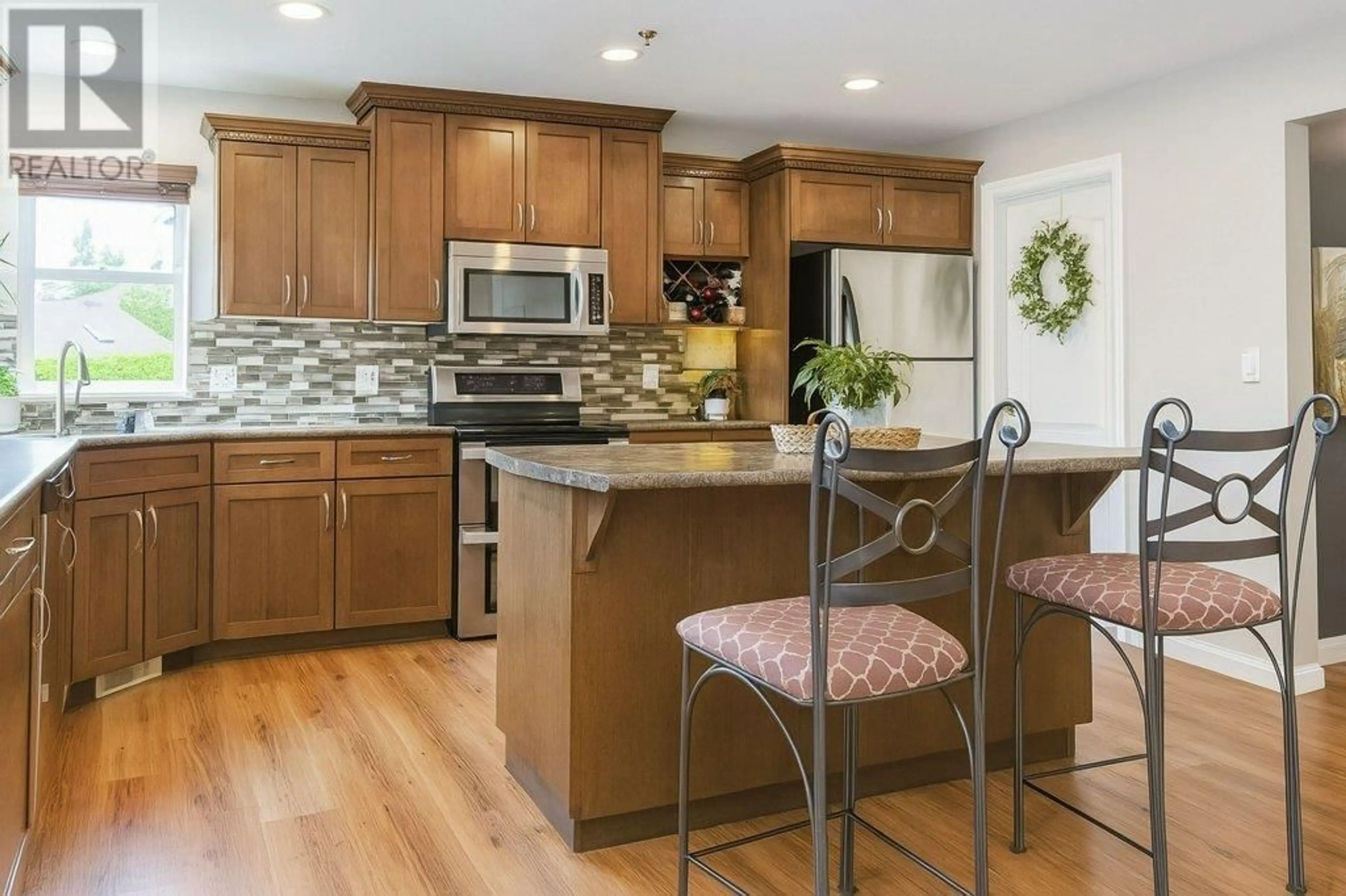 Open concept kitchen, wood/laminate floor for 23862 117B AVENUE, Maple Ridge British Columbia V4R2V4
