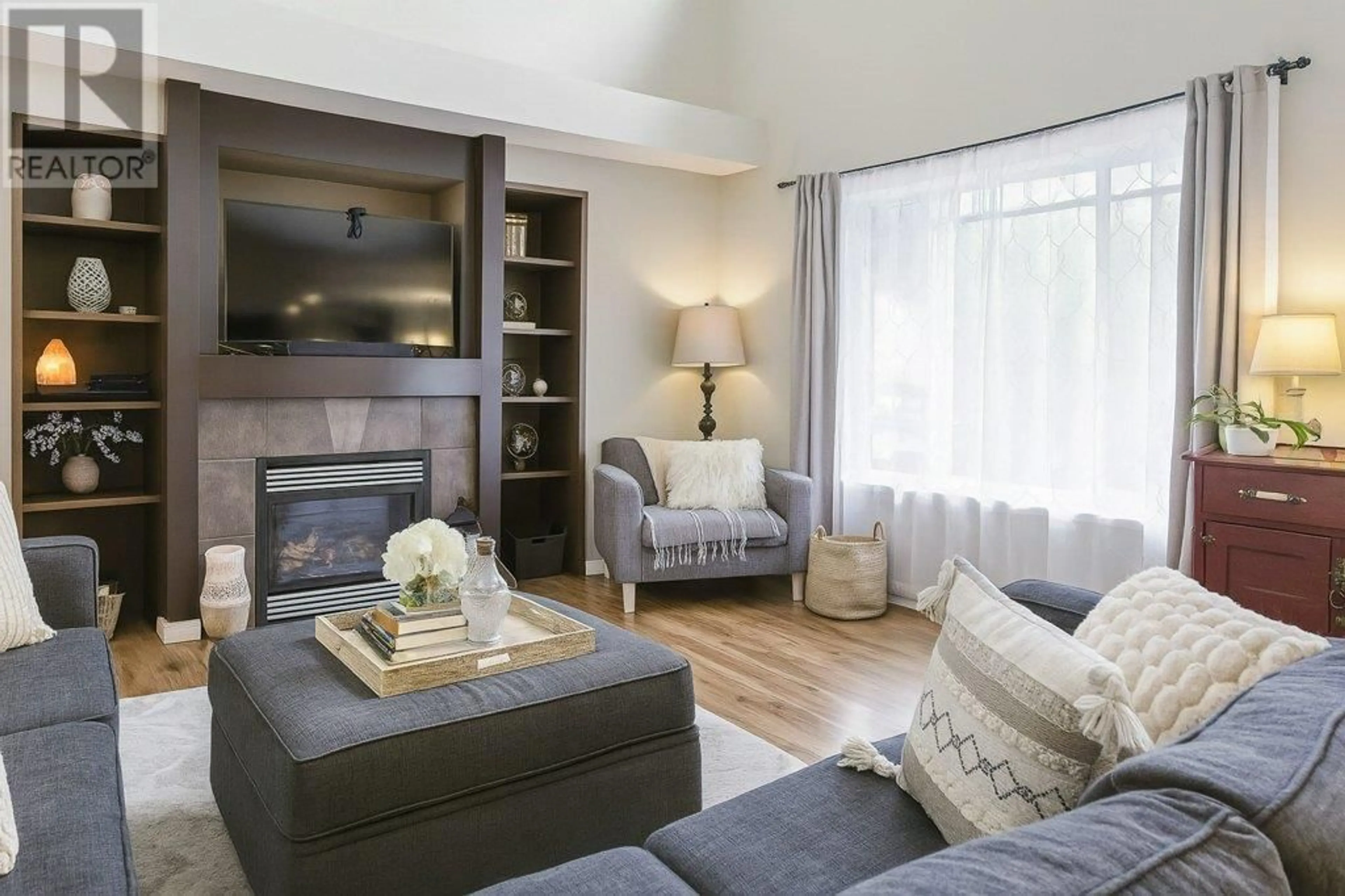 Living room with furniture, wood/laminate floor for 23862 117B AVENUE, Maple Ridge British Columbia V4R2V4