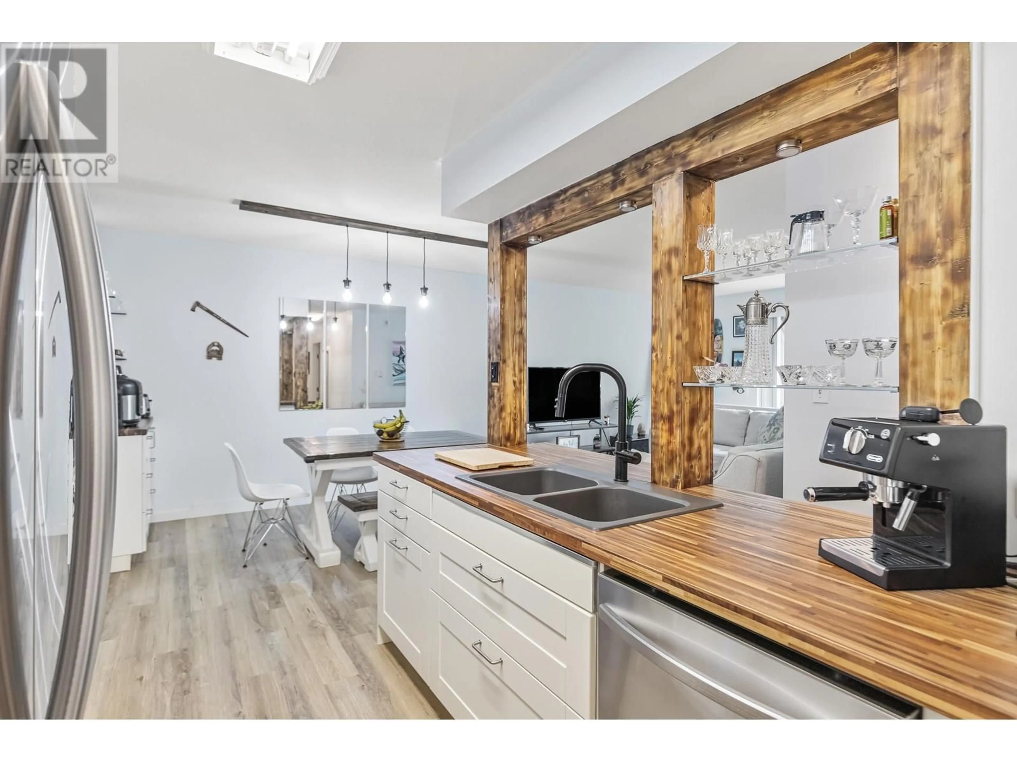 Open concept kitchen, wood/laminate floor for 406 - 1200 PACIFIC STREET, Coquitlam British Columbia V3B6K2