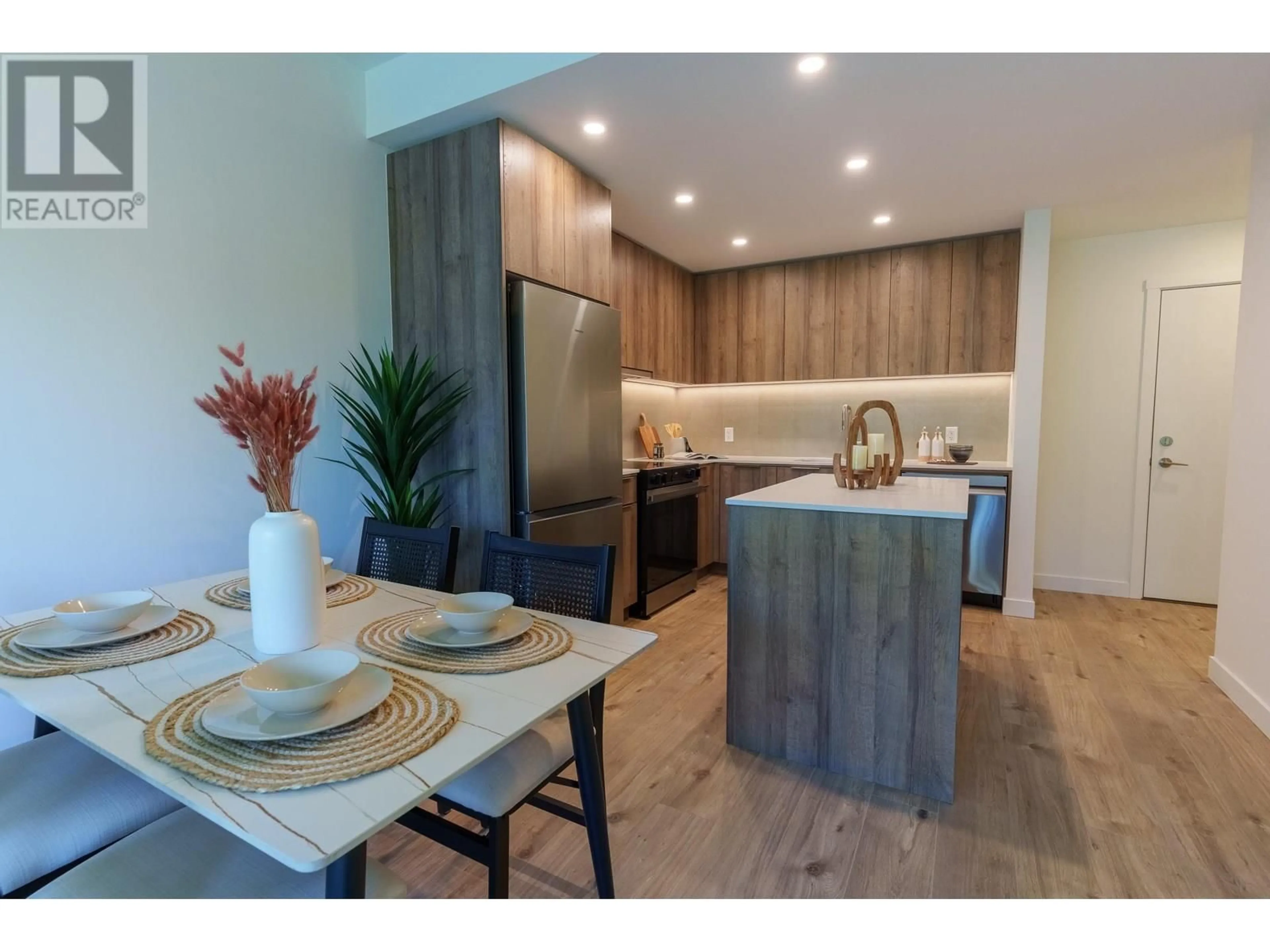 Open concept kitchen, wood/laminate floor for 3594 MALSUM DRIVE, Vancouver British Columbia V7G0B4