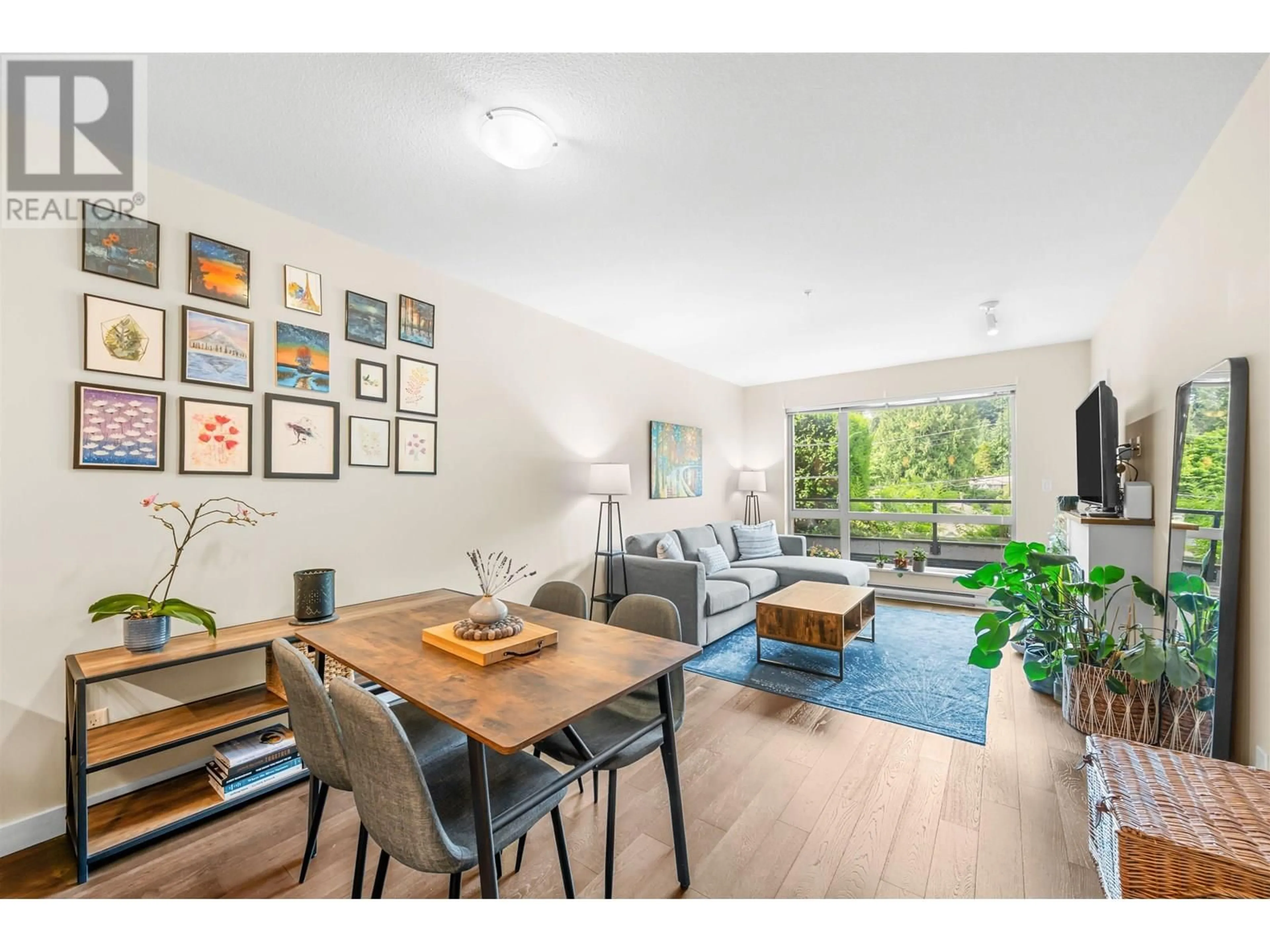 Living room with furniture, wood/laminate floor for 215 - 1330 MARINE DRIVE, North Vancouver British Columbia V7P1T4