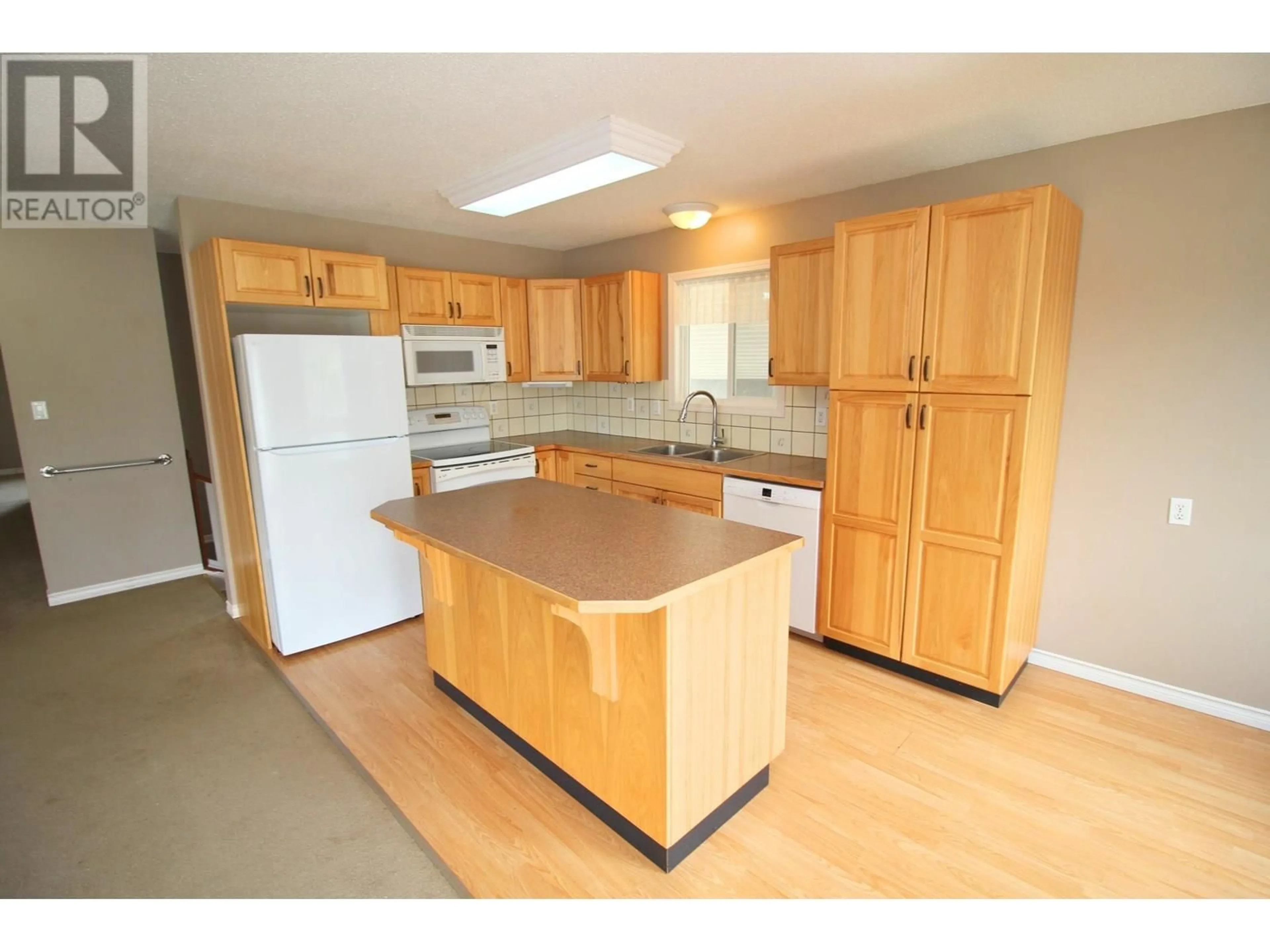 Standard kitchen, wood/laminate floor for 3391 13TH STREET, Houston British Columbia V0J1Z0