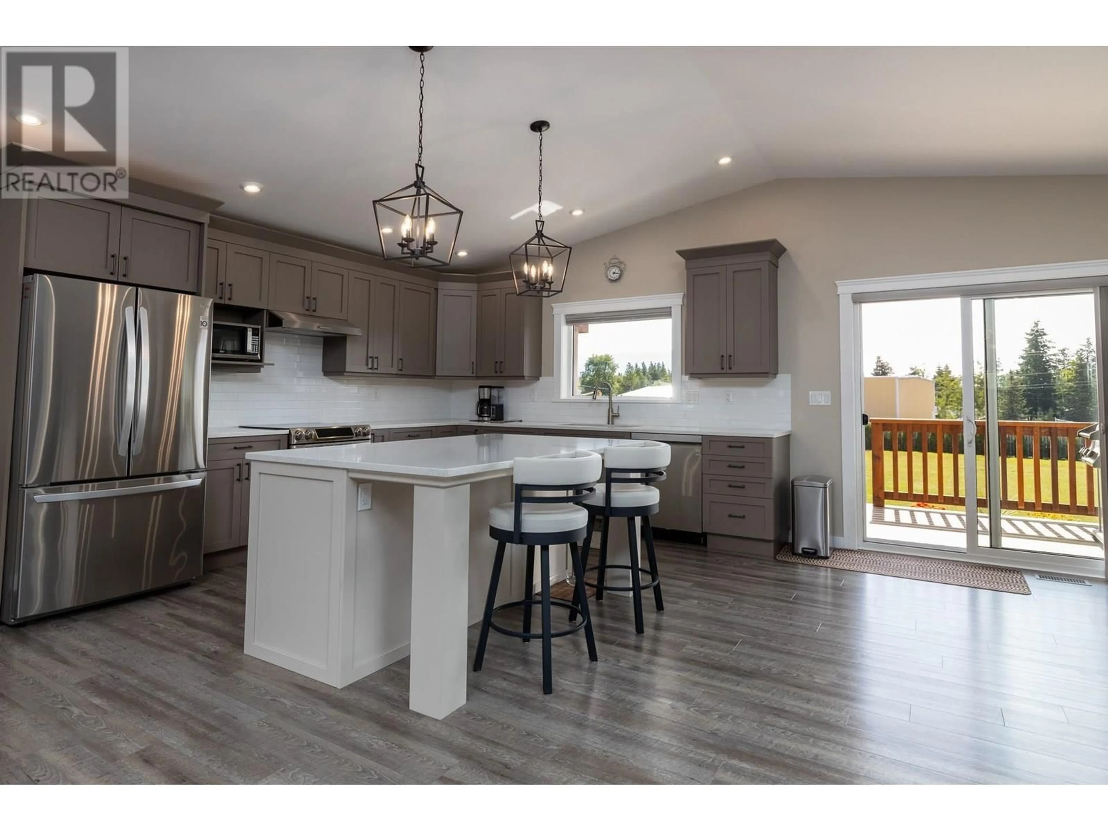Open concept kitchen, wood/laminate floor for 3569 NEWELL AVENUE, Terrace British Columbia V8G5A5