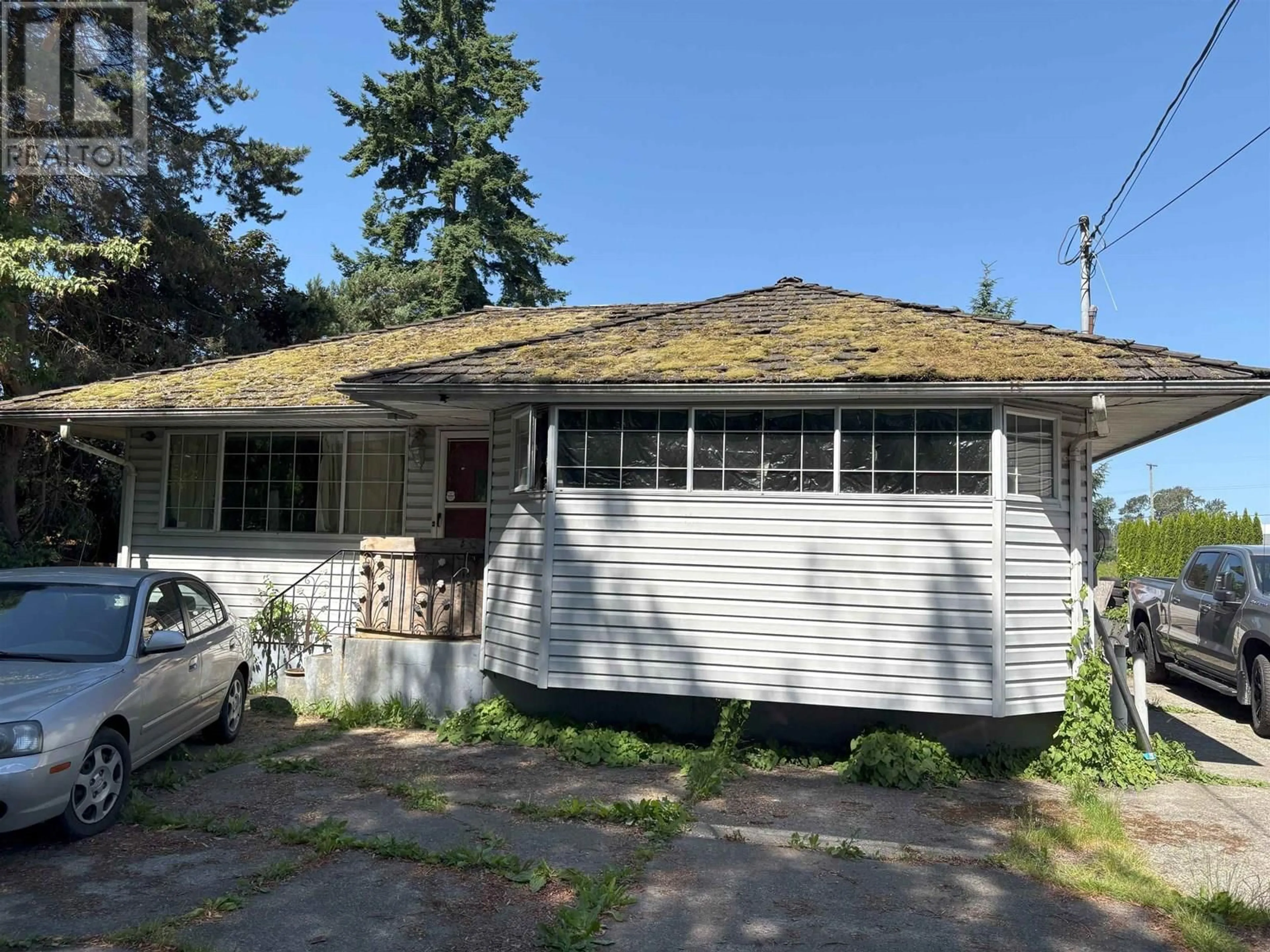 Home with vinyl exterior material, street for 23131 WESTMINSTER HIGHWAY, Richmond British Columbia V6V1B9